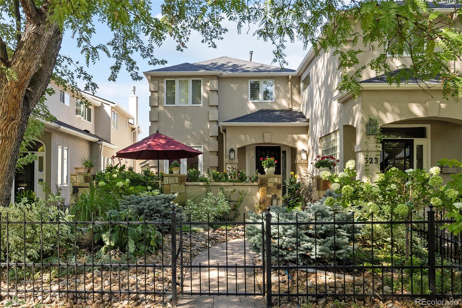 In Denver’s most desirable neighborhood, this stunning townhome has NO HOA and offers the perfect blend of luxury, charm, & comfort. Inside is a warm, inviting space filled with stylish finishes-an effortless ambiance. Every detail has been meticulously maintained, making this home move-in ready. The open-concept is accentuated by soaring ceilings, gorgeous hardwood floors, plantation shutters & abundant natural light. Walk into a comfortable living area anchored by a gas fireplace leading into a spacious private dining room. The floorplan flows effortlessly into the chef's dream kitchen by Williams Ohs w/ knotty alder cabinets, granite + quartzite counters, SS appliances. It opens to the family room a w/ a comfy gas fireplace. Upstairs, the primary en-suite is pure indulgence. Think spa vibes w/ a romantic gas fireplace, private balcony & 2 walk-in closets. The primary bathroom offers the ultimate relaxation experience with a deep soaking tub, dual vanities and a large glass-enclosed shower. Down the hallway is another en-suite bedroom. There is plenty of storage in the finished basement along with another bedroom, bathroom, and great room with built in book shelves. Attached is the oversized 2 car garage for added convenience. You'll fall in love with the AMAZING OUTDOOR SPACES! With your first steps from the street, open the rod iron gate to enter into the lush, professional landscaped garden. It will make you feel as if you walking into the Bridgerton garden, leading you to the beautiful, large private courtyard. But this is not the only outdoor space! Just off the family room is a large terrace with a retractable awning, ideal for al fresco dining and entertaining along with a balcony off the primary bedroom. And when it's time to explore, step outside and you are mere steps from the pulse of Cherry Creek North - world class dining, shopping, art and culture all at your fingertips. This isn't just a home. It's a mood. A moment. A move you won't regret.