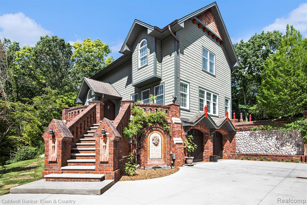 An enchanting, peaceful , wooded 5 acre estate located in Highland, MI with a Holly, MI address .
This Home showcases the Fine Craftsmanship of English Inspired Architecture/Crown Moldings/Coffered Ceilings/Cherry cabinets/Antiqued Travertine  in Kitchen /  solid Walnut and custom ceramic flooring /Solid Walnut Gothic doors throughout/  4 bedrooms/ 3 1/2 Bath all custom ceramic walls
Both Garage Door Openers replaced 2024 / Exterior and misc interior Painted 2023 / (2021) Water softener replaced (owned)/(2020) New driveway and upper driveway and motor court  greets you as you approach the English inspired architecture. Numerous Gothic features abound in the custom brickwork, patio fireplace and handmade ceramic decorative tiles.  Magical wall fountain with spitter (added 2018)  upon arrival into the motor court.  Once inside you’ll find natural antiqued 24x24” travertine pavers in the foyer and kitchen /2020 updates include… 3rd Bath ,Dog shower in garage, expansive landscaping , Ridgeline on Roof , A/C ,Tankless Hot water ,Gas Cooktop replaced \installed ,Natural GAS Installed from Street / (2019) New Maytag Washer & Dryer,  Man cave, she shed 1400 sq ft , Drywalled &heated (wood & baseboard) ,and Large attached Garden shed completed with Permit (2018) Generac Whole house Gen. ,Gothic fireplace in Living room , Copper Gutters & Spouts, Majority of Interior Painted / (2015) Roof Replaced  / Professional Maintenance in Last 6 months include,(Septic pump out , Ductwork Cleaning, Attic Inspection for critters,  Landscape with Mulch install $12,000 Resealed all Asphalt Drive)          
This Pampered Home will Offer Years of Worry free living with the Current Updates
All on a Private Lane with 12 ,5 acres Parcels            see Docs for Sub Information
