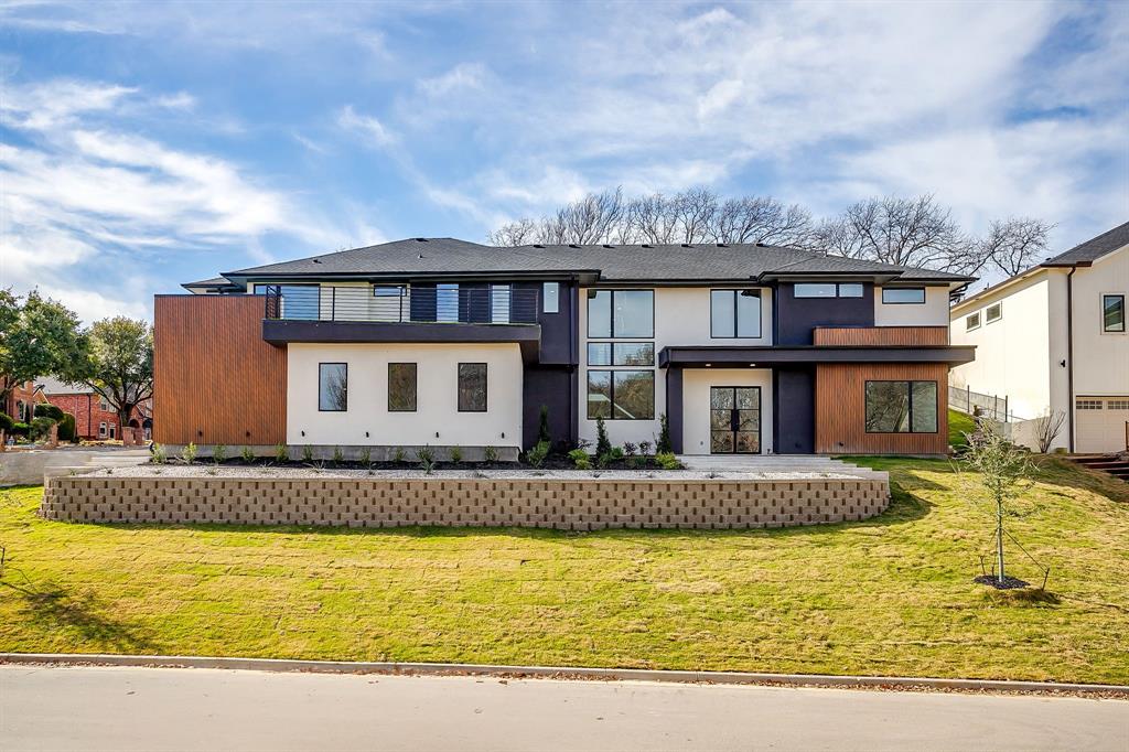 Experience contemporary luxury in this brand-new modern residence. Constructed with a steel frame for exceptional strength and energy-efficient foam insulation for year-round comfort and savings. Located just a few blocks from Lake Arlington, this 5-bedroom, 5.5-bath home offers the perfect blend of innovation and style in prime location. Soaring ceilings and abundant natural light throughout the home, highlighting the clean architectural lines and expansive living spaces. The chef’s kitchen is a true showpiece, featuring an oversized island perfect for entertaining, premium appliances, modern canbinetry and seamless flow into the main living areas. Large primary bedroom has plenty of room for a sitting area and ensuite  bath with dual sinks, walk in shower, soaker tub and custom his and hers closets. 4 secondary bedrooms each with their own dedicated bathroom and walk in closet. A turffed balcony with view of the lake and 4 car tandum garage with seperate golf cart bay.