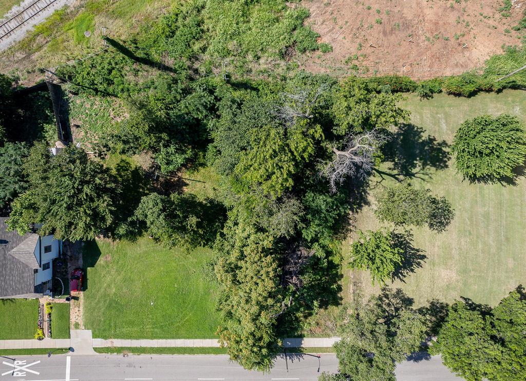 Partially cleared residential lot located near Downtown Oklahoma City, the Innovation District, and OU Health Sciences Center. Zoned R-1 (Single-Family Residential), this property offers a great opportunity for new construction in an area experiencing ongoing revitalization. Approx. 6,970 sq ft (mol) per county records, with paved street access and utilities available at the road (buyer to verify). No HOA. Buyer to perform their own due diligence regarding zoning, land use, lot dimensions, setbacks, and utility connections. Listing Broker and Brokerage make no warranties or representations.