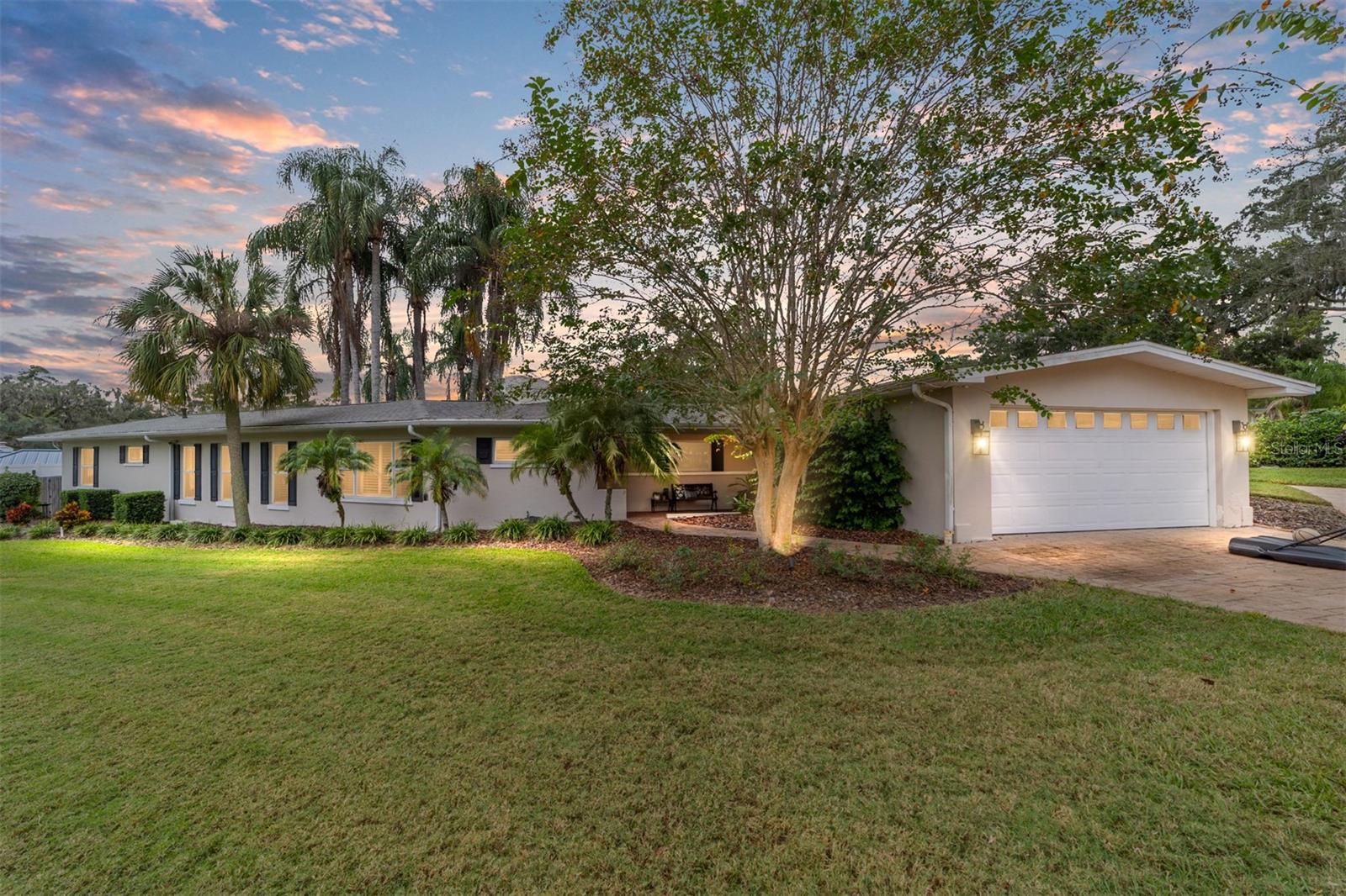 Welcome home to this stunning 4 bedroom 3 full bath home located in the highly sought after woodfields area neighborhood - just minutes from charming downtown Ocala. Completely updated in 2021, this residence perfectly blends modern style with timeless character. Step inside to find spacious, light-filled living areas with two inviting fireplaces, a chefs kitchen boasts contemporary finishes with stainless steel appliances and ample counter space. The primary suite offers comfort and its own luxury retreat. Outside you'll enjoy your own backyard oasis with a large private pool surrounded by stamped concrete pavers and lush landscaping with gorgeous established palms. With golf cart access to downtown's finest dining, shopping and entertainment, this property delivers the ideal Ocala lifestyle - modern upgrades, classic charm and the unbeatable location.