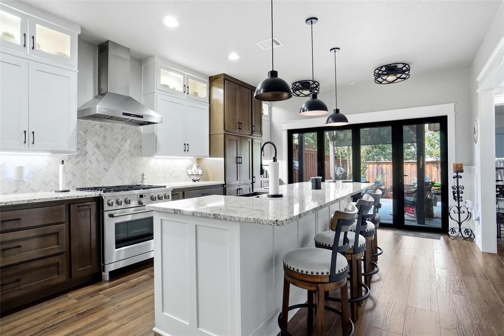 WELCOME TO 905 MARY LANE, HURST, TEXAS 76053! LOCATED IN BETTYS ADDITION AND IS A HALF DUPLEX*REMODELD AND UPDATED IN 2024, THE DREAM KITCHEN IS AWESOME WITH UPDATED 42 INCH GLASS FRONT WHITE CABINETRY TO THE CEILING*THE KITCHEN IS EQUIPPED WITH A CAFÉ 6 BURNER GAS RANGE, CAFÉ ENERGY STAR REFERIGERATOR THAT CONVEYS, SHARP MICROWAVE AND DISHWASHER*THE FOCAL POINT OF THE KITCHEN IS THE 10 X 4 GRANITE ISLAND-BREAKFAST BAR WITH SEATING FOR 6*THERE ARE 2 PROPELLER FANS, 3 LOVELY FARMSTYLE FIXTURES OVER THE ISLAND, HERRINGBONE PATTERN TILED BACKSPLASH, ACCORDION DOORS TO THE PATIO, WOOD PANELING UP THE BAR, GOOSE NECK STYLE FAUCET AND BUILT-IN PLANNING DESK IN THE GOURMET KITCHEN*THE OUTDOOR PAVILION AND LIVING AREA PROVIDE PRIVACY AND A GREAT AREA FOR ENTERTAINING*ADDITIONAL EXTERIOR FEATURES INCLUDE A CEDAR PRIVACY FENCE WITH CAP, ROCK WALKING PATH, LOVELY FLOWER BEDS, GUTTERS, BRICK CONSTRUCTION, GATE, SOLAR SCREENS, SPRINKLER SYSTEM AND TV THAT CONVEYS AT THE PAVILLION*2 BRADFORD PEAR TREES, ONE IN FRONT AND ONE IN THE BACK AS WELL AS A JAPANESE MAPLE TREE IN FRONT*THE HVAC SYSTEM REPLACED IN 2024 WHEN THE REMODEL TOOK PLACE*ROOF INSTALLED IN 2023*WASHER, DRYER & FRIDGE WILL CONVEY WITH ACCEPTABLE OFFER*THE DESK IN THE 3RD BEDROOM WILL CONVEY UNLESS THE BUYER WANTS IT REMOVED*DON’T MISS THE COZY FIRELACE IN THE FAMILY ROOM WITH GAS STARTER & LOGS*THE PRIMARY ENSUITE BOASTS A LARGE WALK IN CLOSET WITH SLIDING BARN DOOR, LVP FLOORING, SHOWER-TUB COMBINATION, UPPER & LOWER CABINETRY, GRANITE COUNTER IN BATH, AS WELL AS 2 UNDERMOUNT SINKS*THE 2 CAR GARAGE WITH EPOXY FLOORING MEASURES 20 X 21 AND IS FRONT FACING*ADDITIONAL FEATURES INCLUDE MOTION SENSOR LIGHTING, LOVELY TRIM, PEDIMENTS OVER THE DOORS, WAINSCOTING, ROUNDED CORNERS, CASED DOORWAYS, KEYLESS ENTRY AT FRONT DOOR, COAT CLOSET, LVP FLOORING THROUGHOUT AND DOGGIE DOOR*SURVEY AND T-47 ARE AVAILABLE*SEE 360 TOUR, FLOOR PLANS,  AMENITIES & FEATURES LIST & FLOOR PLANS ON NTREIS