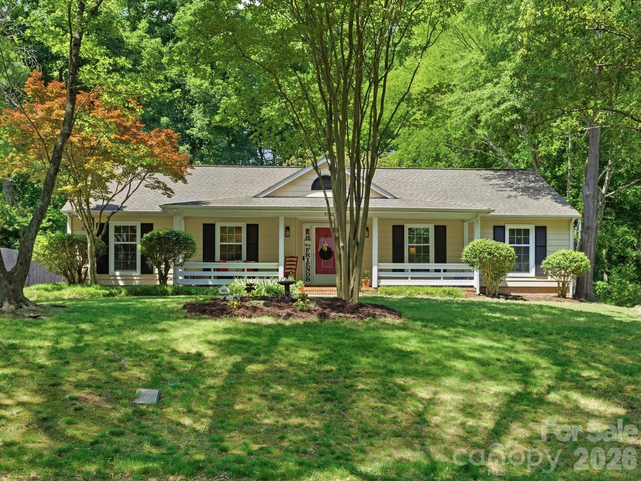 This unassuming, one-story ranch-style home will completely knock your socks off from the moment you arrive. Boasting a long rocking-chair front porch with updated railings, this property perfectly blends classic character with modern convenience. Step inside a formal foyer to discover two separate living areas, updated bathrooms, and a true Chef's kitchen with Kitchen Aid appliances. The brilliant layout features a walk-in laundry room and mudroom combination, tucked right off the kitchen and driveway for everyday practicality. The neighborhood is full of beautiful and mature trees, offering a private retreat for entertaining in this large back yard. Host watch parties on the back deck, roast s'mores by the fire pit, or utilize the attached exterior storage and bonus backyard shed. Nestled in a prime location just minutes from the Ballantyne Bowl, Amp, shopping, and dining, this lovingly maintained home is ready for its next chapter. Don't wait!