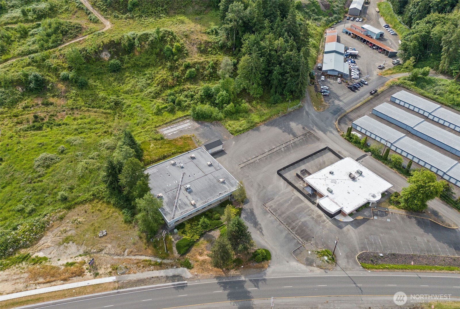 Excellent opportunity in a prime location! This 12,000+ sq ft commercial building offers versatility and space for a variety of business uses. Features include multiple private office suites, two restroom locations, and a central break room. Plenty of room for teams, clients, and operations. An additional outbuilding provides extra storage, ideal for equipment or inventory. Ample parking and excellent visibility make this a standout property for investors or owner-users. Don’t miss out on this high-potential space!