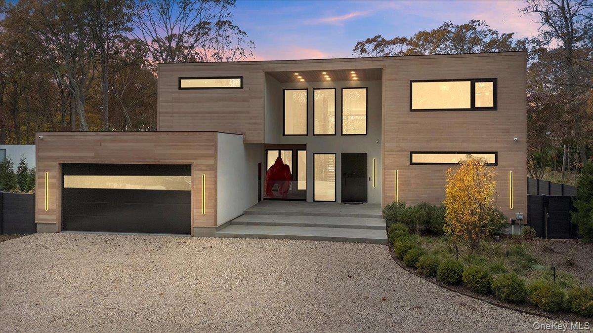 Experience a one-of-a-kind modern retreat offering a true resort experience, wrapped in tranquility, privacy, and elevated design.  Set at the end of a long, wooded driveway on 1.4 acres south of the highway, this brand-new 7-bedroom, 10-bathroom estate delivers architectural drama, refined luxury, and the full Hamptons resort lifestyle and is just minutes from East Hampton Village, Wainscott Ocean Beach, and Wölffer Estate Vineyard.  Step into a breathtaking 25-foot entry with a floating 12-foot chandelier and a serene interior zen garden visible from the foyer and living spaces. The great room stuns with soaring 25-foot glass walls, white oak floors and a fluted-stone fireplace that anchors the modern aesthetic.  The chef’s kitchen is a fully custom Italian-designed masterpiece featuring two sinks, two dishwashers, a 60" Gaggenau gas induction cooktop, Gaggenau double ovens, a built-in automatic coffee system, a hidden walk-in pantry, 36" fridge and freezer, 24" wine cooler, and an oversized island seating eight.  Outside, enjoy a 40' x 18' heated gunite pool with fire-feature water bowls, expansive stone patio, and a pool house with full bathroom and outdoor shower. An outdoor kitchen with grill, sink, and refrigerator creates the perfect summer entertaining space.  Inside, every bedroom features an ensuite bathroom with radiant heated floors and custom closets. The primary suite offers dual walk-in closets, a private balcony overlooking the pool, and a spa-level marble bathroom with heated floors, soaking tub, and an oversized shower.  The fully finished lower level expands your lifestyle with a guest suite, spacious living/media area, and a private sauna for ultimate relaxation.  Additional amenities include two laundry rooms, a two-car garage, Sonance speakers throughout, and every luxury upgrade expected in a modern Hamptons new build.  This is a rare and exquisite modern estate offering true privacy, world-class amenities, and a resort-caliber lifestyle, crafted for the buyer who demands the exceptional.