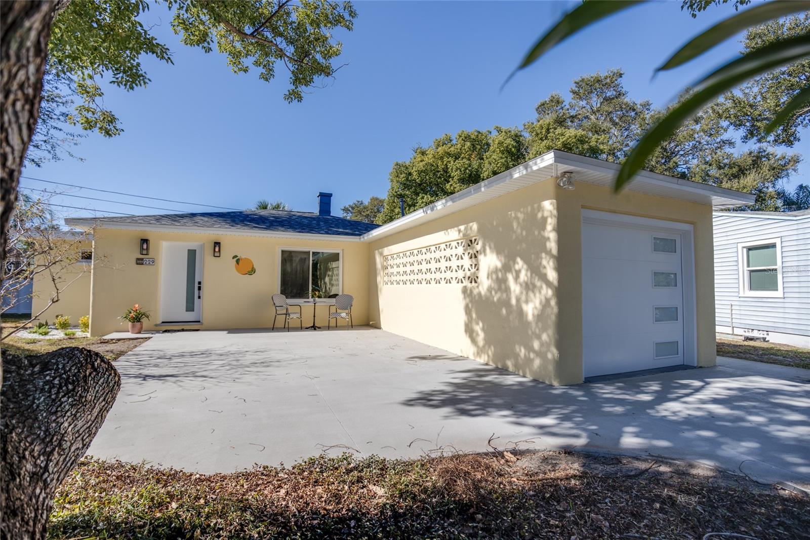 Welcome to 229 Lime Circle!  This Block Constructed Home is Fully Renovated from Top to Bottom. This Location is Perfect for Keeping an Active Lifestyle within the Golf Cart Zone, a Block Away from the Pinellas Trail, and 2 Blocks Away from Iconic "Edgewater Drive".  The Home has Impact Rated Windows & Doors Providing a Lower Cost Annual Insurance.  Brand New Roof, Daikin A/C Handler & Condenser, Hot Water Tank, & All New Samsung Appliances in 2025.  High & Dry - No FLOOD Zone.  Kick Back and Relax in this Charming Vintage Style Home Reimagined!