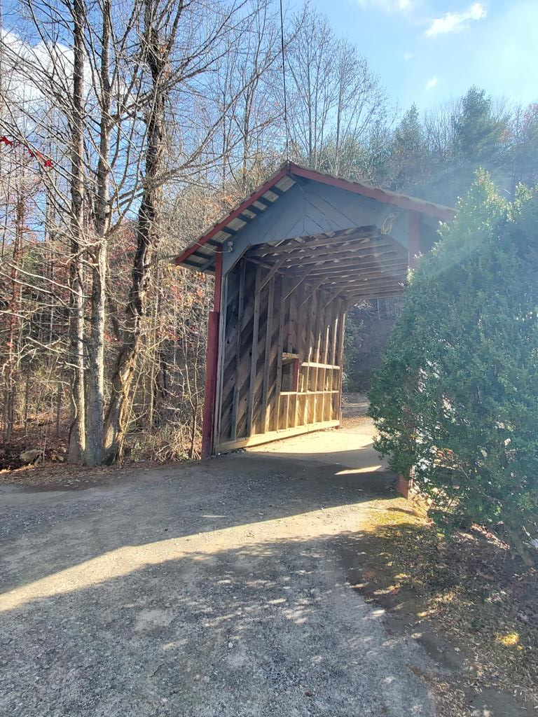 UNRESTRICTED! INVESTORS, BUILDERS, DEVELOPERS!!!  Serene 1+ acre lot with paved drive leading to a building pad with 3-bedroom septic system installed. Property also has access to a drilled well (pump and water line needed). Fiber Optic Internet and electric available on P'tree Mtn Estates Dr. If you are seeking UNRESTRICTED acreage, look no further! Seasonal mountain views, top a few trees and have year-round mountain views! So many possibilities for investors or developers. Additional 1+ acre lot available for additional privacy. Just minutes from hospital, Harrah's Casino, shopping, and downtown Murphy. This is a must see in a great area! *Use caution on Katerina Lane - asphalt recently treated with moss removal treatment and may be slippery*