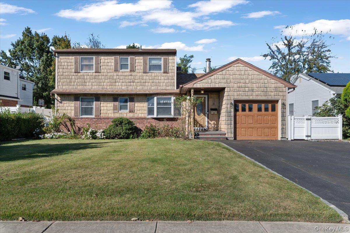 Discover this expanded ranch in North Bethpage, offering 6 bedrooms and 2 bathrooms. This spacious home boasts hardwood floors, a cozy wood-burning fireplace in the livingroom, and a full basement partially finished with a separate entrance. The attached garage provides ample storage space. Enjoy outdoor living with sliders leading to a covered deck and private yard! Roof 2013. Kramer Lane Elementary