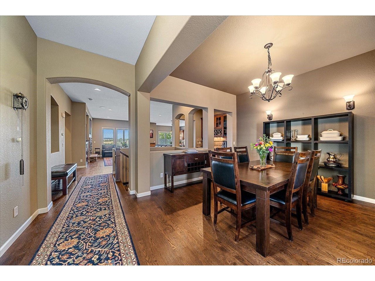 Wonderful family ranch home on open space with main floor primary bedroom. Welcoming formal entry opens to great room with fireplace and high ceilings. Center island kitchen with breakfast nook opens to great room and look out on deck and open space. large primary retreat with ensuite bath and walk in closet. Formal dining room, 2 bedrooms and study on main floor. Fun lower level family with wet bar including wine bar refrigerator and pool table, bedroom, an office/bedroom, exercise room, bonus room and storage round out the lower level. Fenced yard, newer deck with canopy cover. Great community neighborhood with golf course, pool, tennis courts, parks, walking/jogging paths and award winning schools.