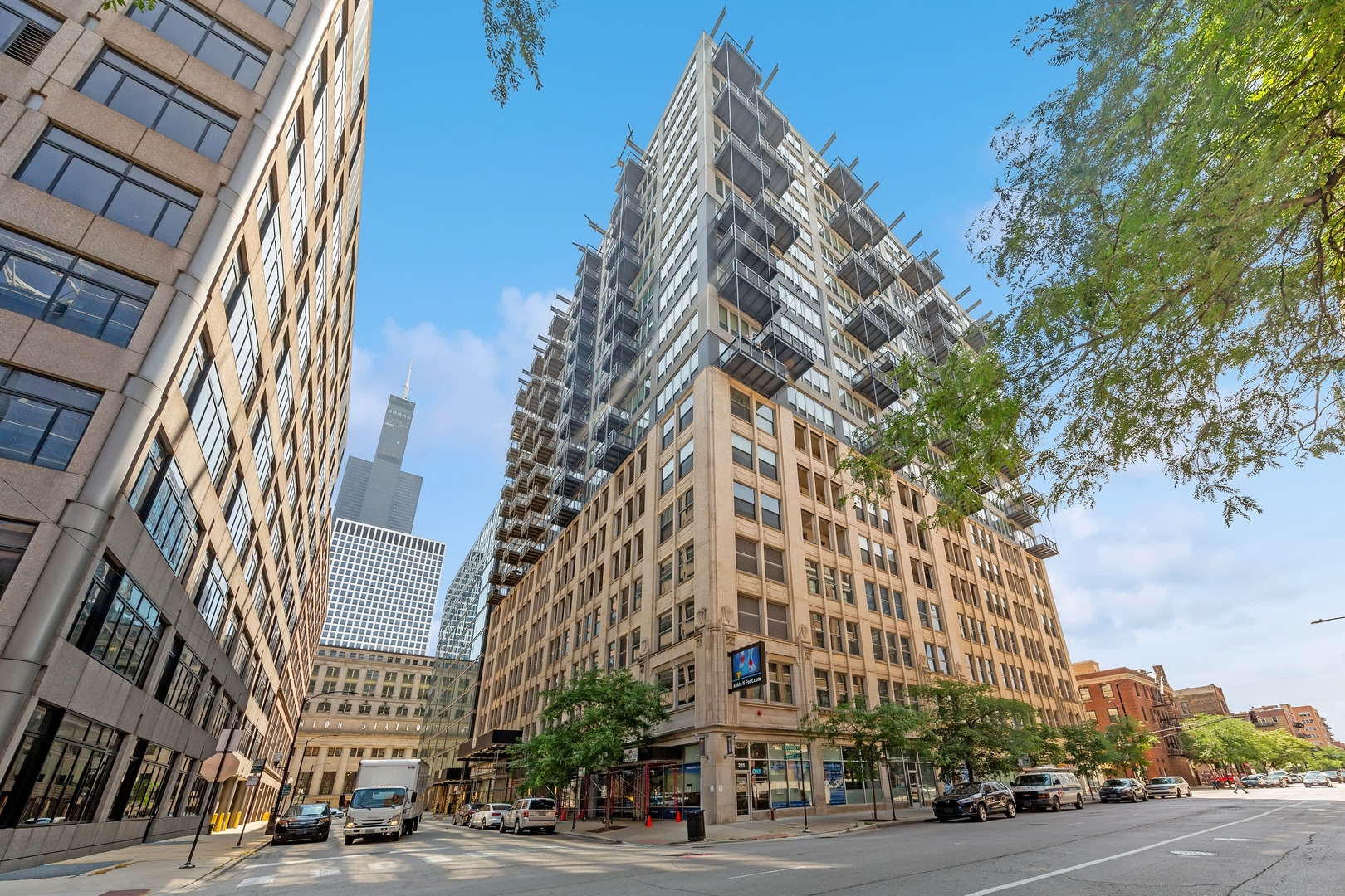 Welcome home to one of the West Loop's most sought-after Belgravia residences!  Come see this elegant and sun-filled retreat nestled in one of the most convenient and vibrant neighborhoods in the city!  This well-maintained 1-bedroom, 1-bathroom condo with south-facing, floor-to-ceiling windows offers an open concept floor plan with a huge balcony for calm mornings or peaceful nights, an in-unit washer/dryer, a 13' x 7' kitchen with granite countertops, 42" cabinets, stainless steel appliances (range, microwave, refrigerator/freezer, dishwasher) and a stainless sink. The foyer (with 2 large closets), the kitchen and the living areas all have hardwood floors while the big primary bedroom includes new carpeting, enough space for a king and ample closet space. The furnace was replaced 3 years ago!  Do you like to entertain or be entertained?  Your balcony with beautiful city views overlooks the expansive, 4-season sundeck on the 8th floor with grills, seating areas, green space and skyline views. The building's favorite gathering spot is the impressive 11K sq ft "Q Room" that offers a fitness center, bowling alley, movie theater, bar, lounge, putting green, billiards, ping-pong, darts, foosball and Tide Laundry Lockers. Additional conveniences include a storage unit, an oversized bike room and 24-hour door staff.  Convenience? The building is a short walk to Union Station (4 min), Ogilvie Station (7 min) and the CTA Blue Line (6 min) and it's super close to everything: all major expressways, Fulton Market, downtown, Randolph Restaurant Row, Greektown, parks, dog runs, Whole Foods, Mariano's and more.  See this move-in ready condo soon - it will go fast!  Garage parking can be rented for about $200 per month!