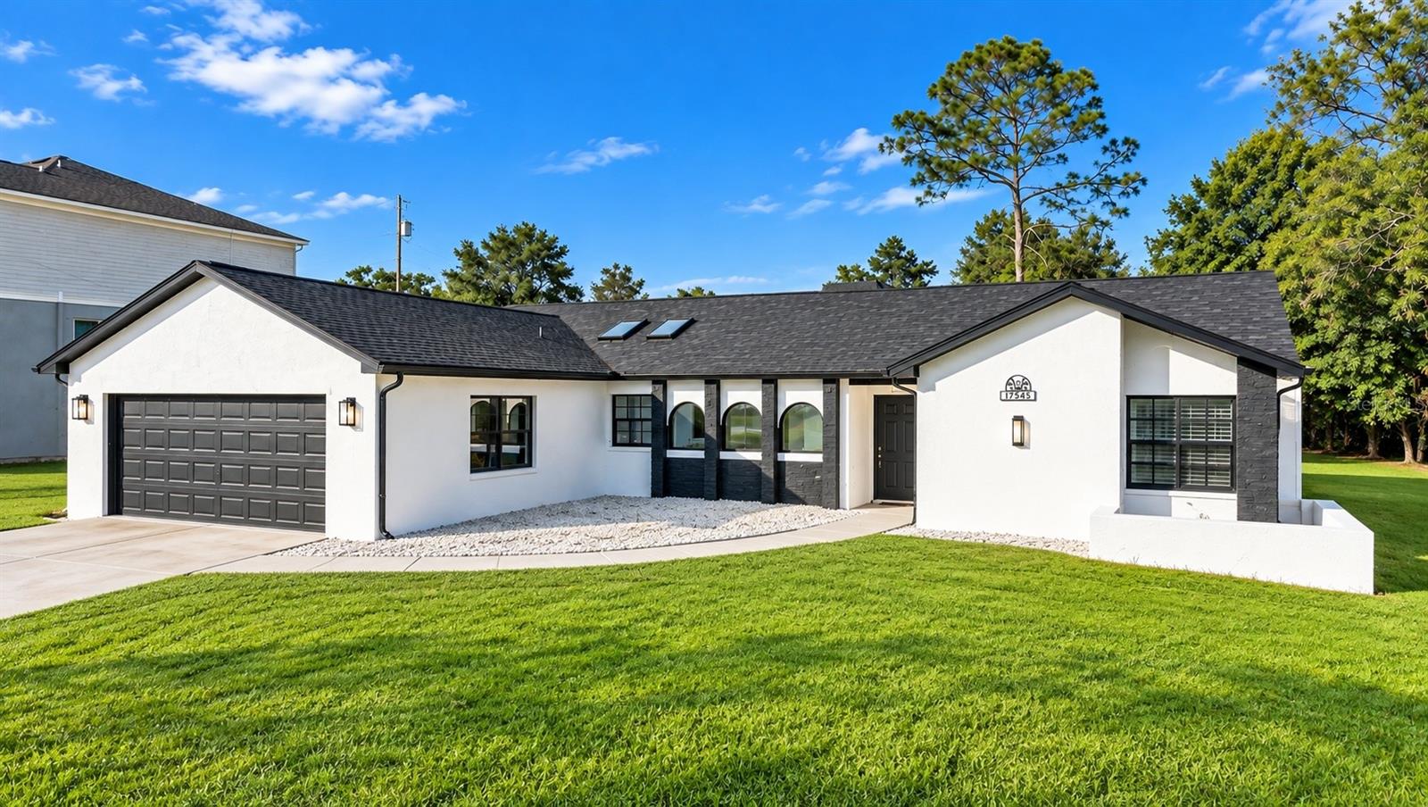 Virtually Staged. Discover your own Florida oasis at this inviting 3-bedroom, 2-bath home in Spring Hill! Offering 1,742 sq. ft. of living space, this home blends comfortable everyday living with standout outdoor amenities. Step inside to a welcoming interior featuring stylish wood-look flooring, a light and airy color palette, and a beautifully updated kitchen with light cabinetry, granite countertops, stainless steel appliances, and a chic tile backsplash. Skylights bring in additional natural light, while the open flow between the kitchen, dining area, and living room creates an inviting setting for entertaining or relaxing at home. The spacious primary suite offers a private retreat, while two additional bedrooms provide flexibility for guests, a home office, or hobbies. A dedicated laundry area and attached two-car garage add everyday convenience. The real showstopper awaits outside! Enjoy your own private swimming pool surrounded by an expansive screened-in lanai, perfect for cooling off on sunny Florida afternoons, hosting weekend gatherings, dining al fresco, or simply unwinding without the nuisance of insects. An additional covered porch provides even more space to enjoy the Florida lifestyle. The generous outdoor footprint creates a wonderful extension of the home's living and entertaining areas. Ideally situated in Spring Hill, you'll have opportunities to explore the best of Florida's Nature Coast, from the famous mermaid shows and crystal-clear springs at Weeki Wachee Springs State Park to kayaking and paddleboarding along the scenic Weeki Wachee River. Enjoy waterfront recreation at Rogers Park or take a drive to Pine Island Beach for a relaxing day along the Gulf Coast. Whether you're searching for a full-time residence, a Florida getaway, or a home with exceptional outdoor entertaining potential, this inviting property delivers comfort, versatility, and the laid-back lifestyle Florida is known for. Come see the possibilities and imagine making this Spring Hill retreat your own!