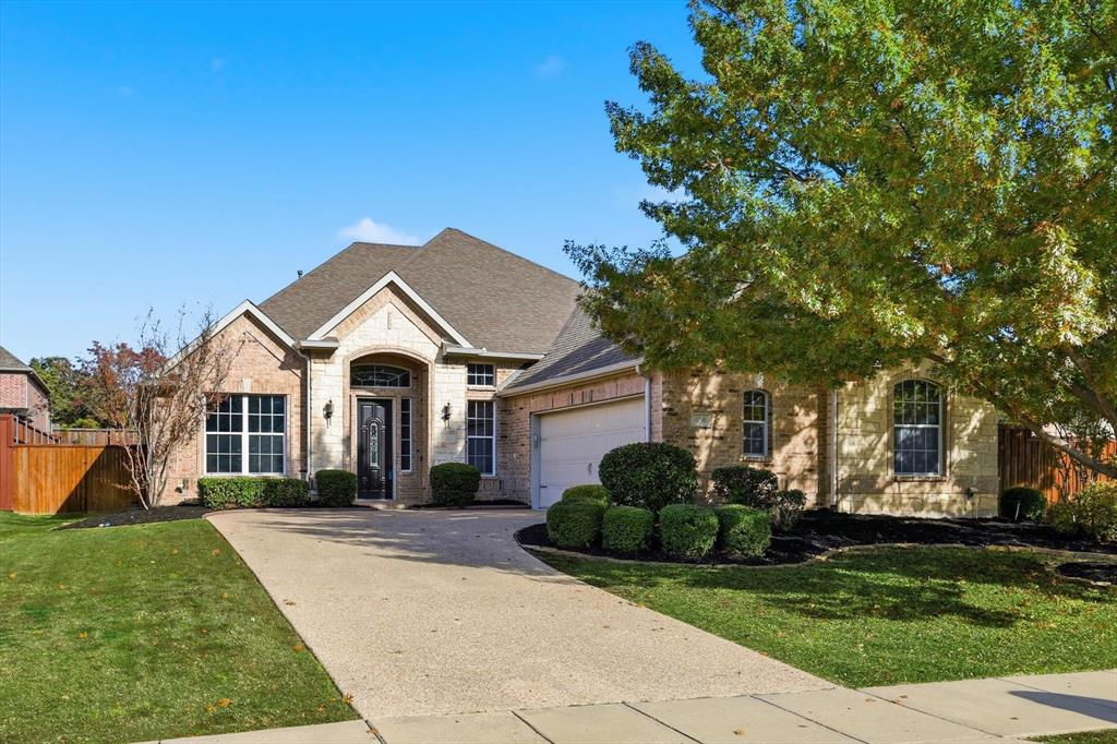 Welcome to this beautiful home in the highly sought-after Wellington Estates community of Flower Mound. Situated on a spacious corner lot, this property offers the perfect blend of comfort, functionality, and natural light throughout. With four bedrooms, including one that can easily function as a second study or flex space, this layout adapts to a variety of needs. A dedicated study at the front of the home features beautiful built-in cabinetry, creating the perfect workspace or library. The large family room, complete with a gas fireplace, overlooks the backyard and opens seamlessly to the kitchen, making it an ideal gathering spot. The expansive kitchen is designed for both everyday living and entertaining, featuring granite countertops, a 5-burner gas cooktop, a large island, abundant storage, a walk-in pantry, and a convenient butler’s pantry leading into the dining room. Fresh paint in the main living areas creates a bright, clean, and inviting feel. Step outside to a generous backyard patio - perfect for hosting guests, enjoying morning coffee, or winding down in the evenings. Residents of Wellington Estates enjoy excellent amenities including a clubhouse, fitness center, pools, playgrounds, and walking trails.