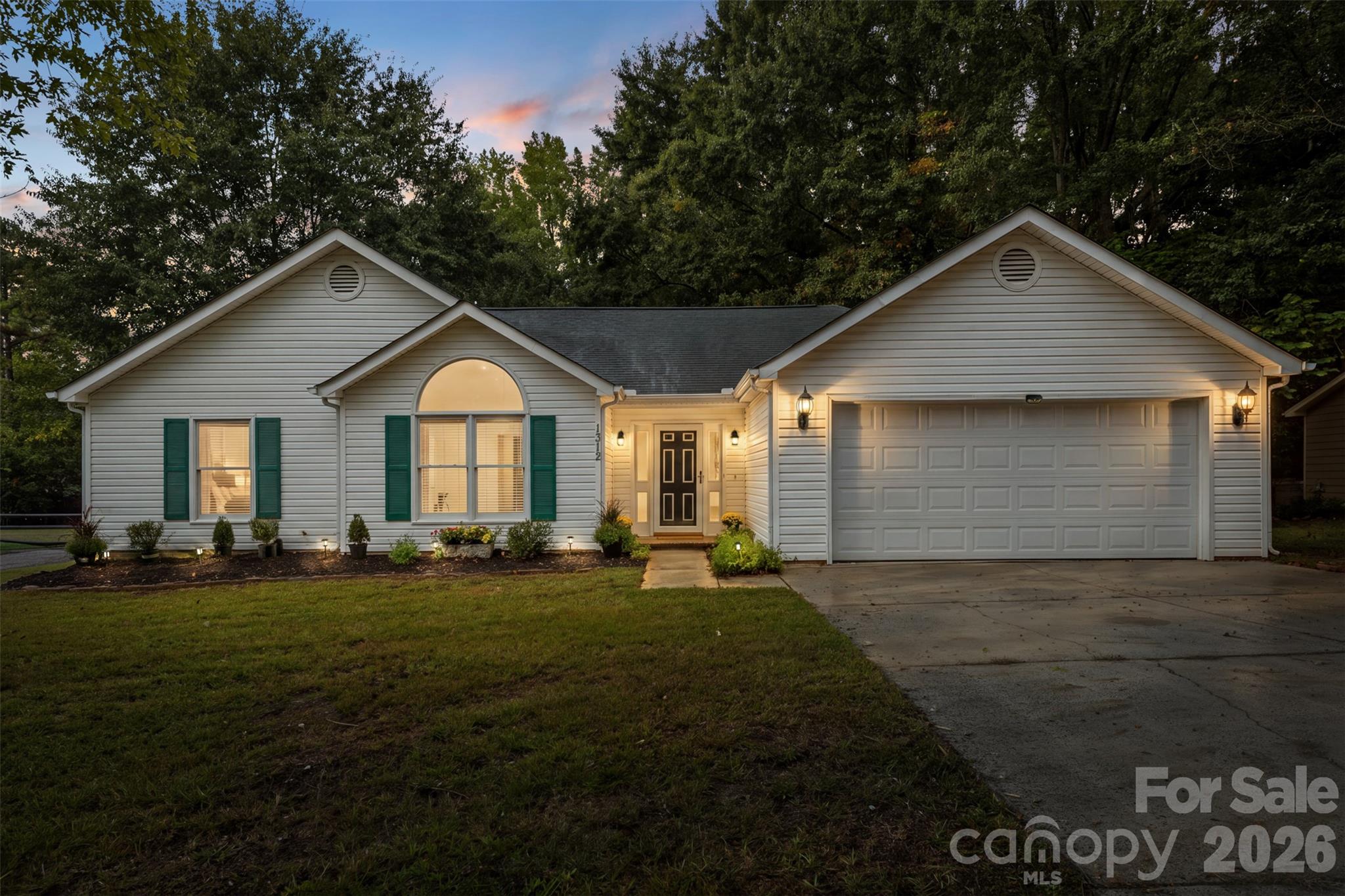 Welcome to 1312 Newfound Hollow Drive, a bright and beautifully refreshed, move-in-ready 3- bedroom, 2-bath home offering convenient one-level living in an established neighborhood with no HOA. Filled with natural light, updates include new LVP flooring throughout the main living areas and bathrooms, new carpet in all bedrooms, fresh paint, designer selected  fixtures, and  brand-new HVAC system installed in 2026.The charming eat-in kitchen offers a lovely bay window overlooking the spacious and private backyard, while the attached 2-car garage adds convenience and valuable storage space.Located just minutes from the U.S. Whitewater Center, convenient to Charlotte Douglas International Airport, and offering easy access to Charlotte, surrounding towns, and major highways, this home combines modern updates with comfort, flexibility, and everyday convenience. Schedule your private showing today!