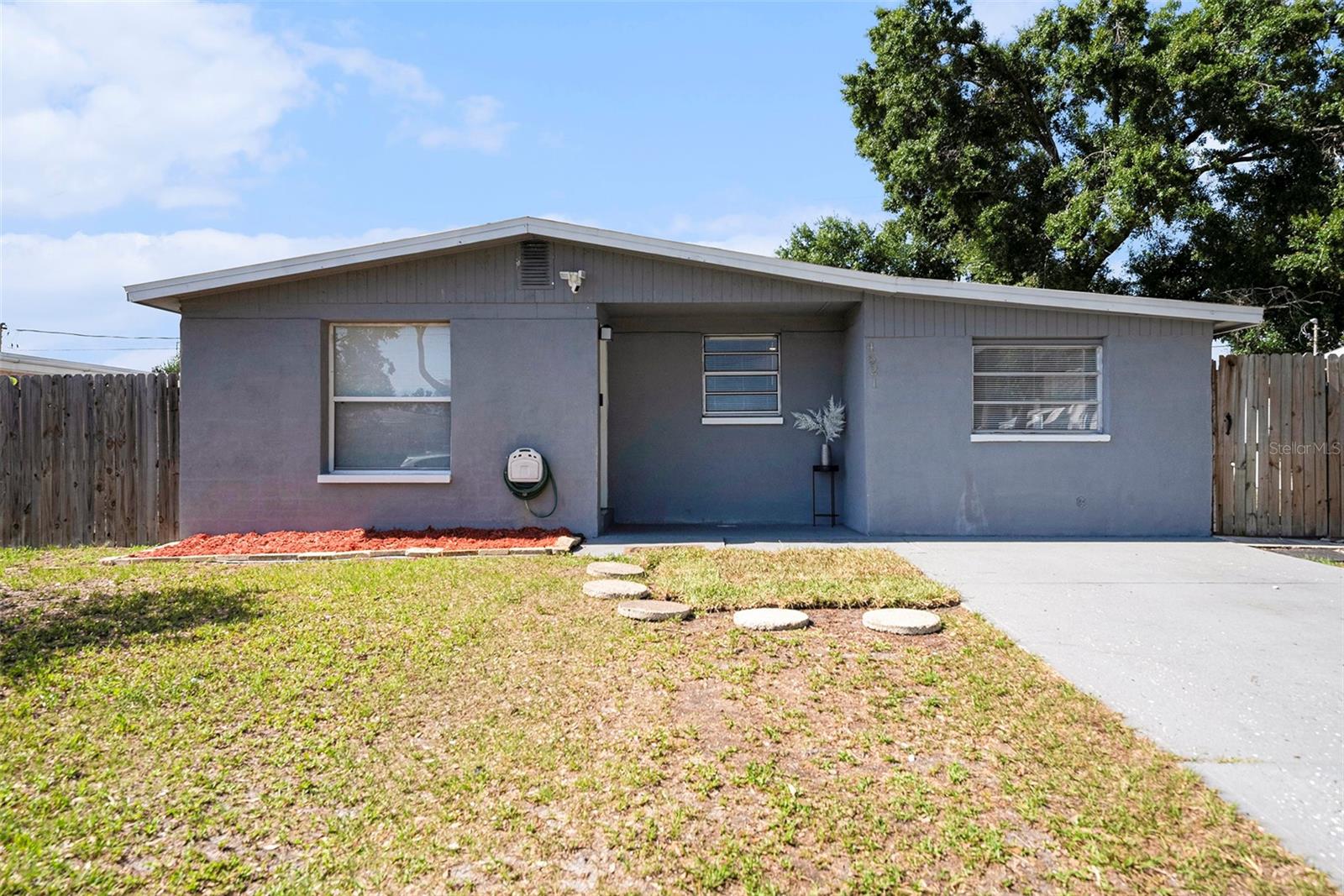 Welcome home to this thoughtfully updated 3-bedroom, 2-bath single-family residence located in a charming, well-established Tampa neighborhood with no HOA or CDD. Designed with a split floor plan, this home offers both privacy and flexibility, including a versatile flex space that can easily function as a home office, guest suite, or mother-in-law setup.Natural light fills the home, highlighting upgraded bathroom finishes, stainless steel appliances, newer windows, and a cozy fireplace that anchors the main living area. A large laundry room adds everyday convenience, while recent improvements including a roof and HVAC system that are both only 3 years old, along with new doors, provide peace of mind for the next owner.Situated on an oversized lot, the fully fenced backyard offers ample outdoor space along with a storage shed designed to keep contents dry and protected. With a private driveway and no required flood insurance, this home checks both lifestyle and practical boxes.Ideally located just 10 minutes from International Plaza, Tampa International Airport, and only 15 minutes from attractions like Armature Works and Hyde Park Village, this property offers warmth, functionality, and room to make it your own, all within an adorable Tampa neighborhood.