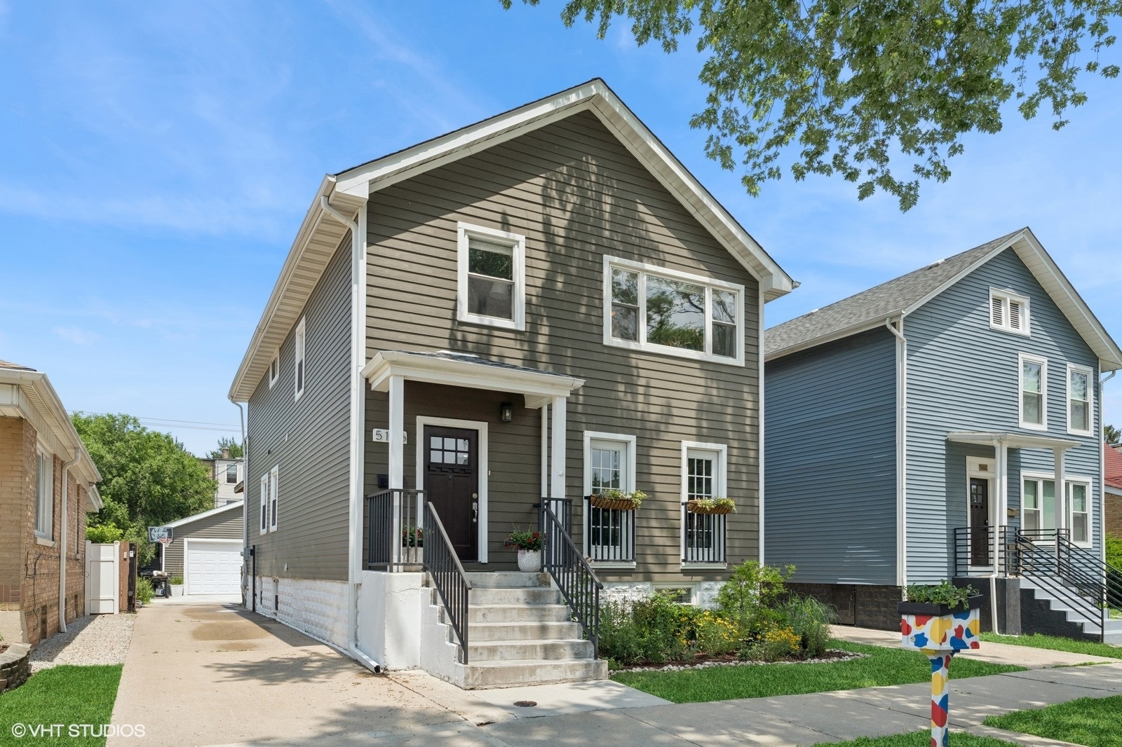 Located on a tree-lined block in sought-after Portage Park, this single-family home is one to remember. This 4-bedroom, 3.5-bathroom home is located on an extra-wide lot, and is filled with countless updates. As you first take in the home, you will note the charming curb appeal, thanks to fresh landscaping and gated private driveway.    From the moment you walk through the front door, you can feel the extra width thanks to the larger lot size.     First, head into the spacious living room and notice the gleaming hardwood floors & afternoon sun pouring in through the south-facing Juliet balconies. Don't miss the built-ins surrounding your cozy fireplace and wainscoting throughout. There is plenty of room for a large sectional, additional seating, and a large TV.     Next take in the gorgeous kitchen - here you'll find shaker white cabinets, stainless steel appliances, timeless subway tile, quartz countertops, and an island with tons of barstool seating. The dining space is conveniently located right off the kitchen & is spacious enough for a grand table with plenty of seating.     Also located on the main floor are a convenient front coat closet, a built-in mudroom, and a colorful powder bathroom.    Head upstairs to the second floor, where you will find 3 spacious bedrooms. The primary suite is the epitome of luxury, with 16-foot vaulted ceilings, a walk-in closet, and an en-suite bathroom with a massive shower and dual vanity.    There are two additional bedrooms that are both generously sized and perfect for guest bedrooms, nurseries, offices, or a combination! The second full bathroom features a soaking tub. Don't miss the laundry room, conveniently located on this floor (no trekking down to the basement to do laundry!).    Downstairs, you will find a spacious second living room that is light and bright thanks to windows and new carpet. Next, take in the fourth bedroom, which is perfect for a home gym, office, guest room, or all of the above! Rounding out the basement is the third full bathroom, a storage closet, and an additional storage room.     Outside the home is your outdoor oasis, which is fully fenced in. You have the best of both worlds here, with a large deck off the back of the home, a concrete driveway and patio for your outdoor furniture and grill, plus tons of grass space and room for gardening. You'll also find the two-car garage.    The entire home was gut-rehabbed in 2018, and no update was overlooked. You'll fall for this one-of-a-kind home, and the neighborhood as well -- you are minutes away from 6 Corners bars and restaurants, grocery stores, parks, the Metra, and 90/94. Welcome home.