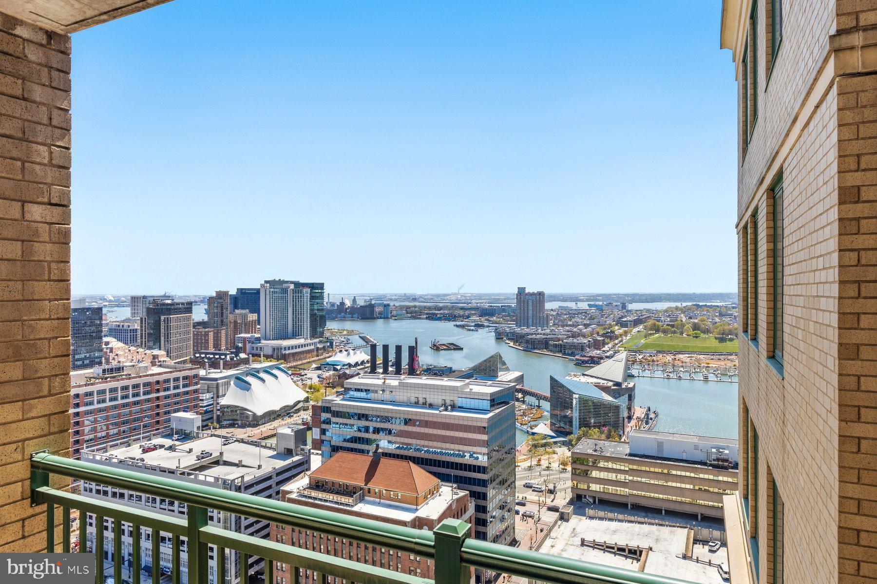**PRICE IMPROVEMENT**Experience elevated city living with breathtaking Inner Harbor views from this stunning 30th-floor 2BR/2BA condo in the heart of Downtown Baltimore.Step into a light-filled, open-concept layout featuring hardwood floors, recessed lighting, and a soft, modern palette—all complemented by panoramic water views from every room. The spacious living area flows seamlessly into the kitchen, complete with stainless steel appliances, granite countertops, ample cabinetry, and a breakfast bar overlooking the main space. The thoughtfully designed layout offers privacy with bedrooms on opposite sides. The primary suite features a walk-in closet and a private full bath with a walk-in shower, while the second bedroom sits adjacent to a full guest bath—perfect for visitors or a home office. Enjoy your morning coffee or unwind in the evening on the private balcony with sweeping skyline views. Residents have access to premium amenities including a rooftop pool, fitness center, and business center.All this just steps from dining, shopping, entertainment, major commuter routes, and Baltimore’s iconic stadiums—plus the convenience of secure garage parking and low-maintenance condo living.