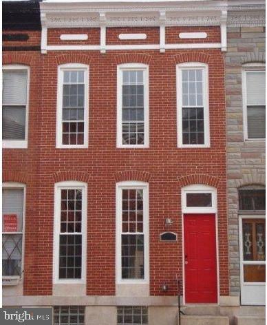 GORGEOUS 3 Bedroom 2.5 Bath BRICK  Front Federal Hill Townhome with Private Parking in Rear of the Property * Features Include:  GLEAMING hardwood floors in the SPACIOUS living room and dining room * LARGE eat in kitchen with GRANITE countertops, island with seating, stainless steel appliances, pantry and recessed lighting * Half bath on MAIN level * Freshly painted * Updated bathrooms * New hot water heater * On the UPPER level you will find a PRIMARY suite * TWO additional bedrooms.  a FULL bath and laundry * Partially finished basement * Rear deck off 2nd floor bedroom with spiral staircase to a ROOFTOP deck with a stunning view of the City * Close to restaurants * This beautiful property has been METICULOUSLY maintained!!