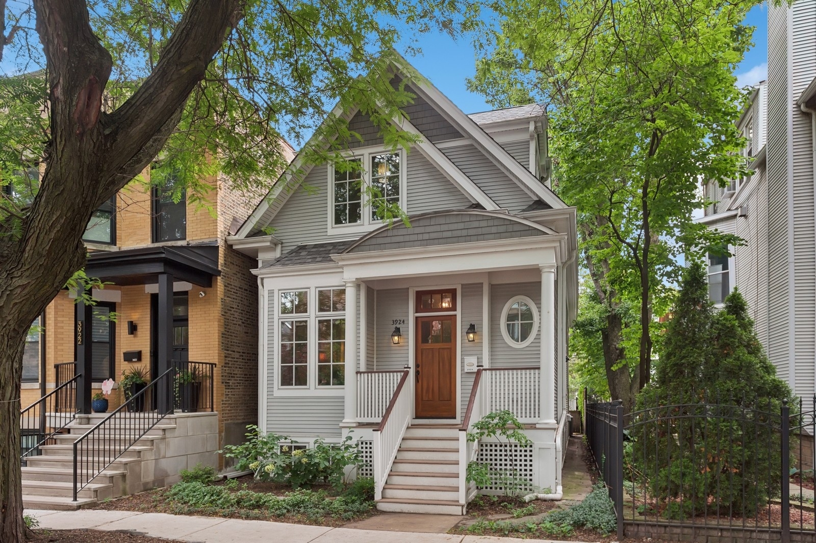 This beautifully remodeled Victorian-era home (renovated in 2011) masterfully blends timeless charm with thoughtful modern updates. Featuring 4 bedrooms and 3.5 bathrooms, the home welcomes you with a lovely entryway that leads to a cozy living room and a dining room with charming built-ins. The spacious kitchen is ideal for both everyday living and entertaining, offering multiple work areas, plenty of cabinet space, a large pantry and space for an eat-in table that overlooks the backyard. The main floor also includes two bedrooms, a full bathroom and a convenient powder room for guests. Upstairs, discover your private sanctuary: a reimagined second floor with a grand family room showcasing vaulted ceilings, a wood-burning fireplace, custom built-ins, surround sound, and a mini-bar-plus access to a private deck. Adjacent to the family room is a perfect office space and a large primary suite with dual walk-in closets and a luxurious spa-like bath, complete with skylights, dual vanities and a whirlpool tub. The finished lower level provides even more flexible space with a large rec room, an additional bedroom and a full bathroom - perfect for a second office, hobbies or a home gym. Located on a picturesque tree-lined one-way street in the coveted Blaine School District, you're just blocks from Southport Corridor's vibrant shops, restaurants & the Music Box Theater as well as public transportation, including the Irving Park Brown Line. This is truly one of a kind!