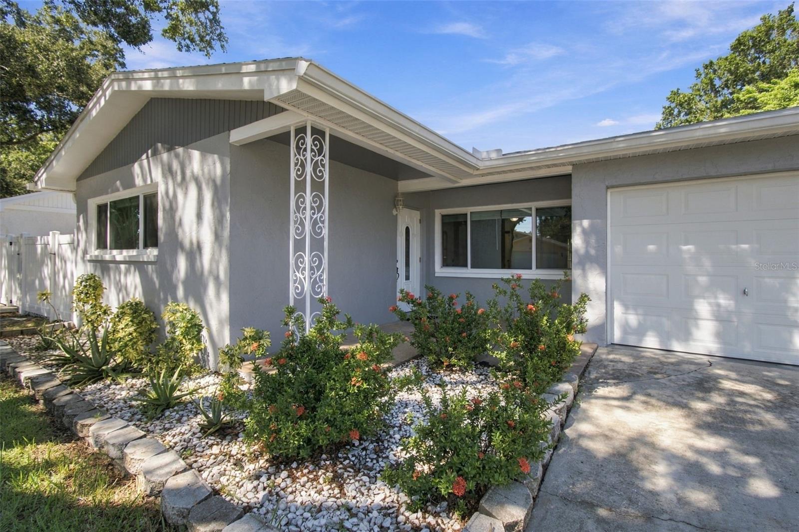 Some photos have been virtually staged. Move in ready 3-bedroom, 2-bath home, where thoughtful updates, comfortable living spaces, and opportunities to add your personal touch await! New flooring, freshly painted with a new A/C system (2026), roof (2025) and windows (2022).  The spacious primary bedroom features its own private ensuite bathroom for added comfort and convenience. A generously sized laundry room, offering so much more than just a place to do laundry! Imagine adding cabinetry for extra storage, a coffee bar, or a convenient built-in desk or workspace.  Outside, you'll find a wonderful outdoor space just waiting for your personal touch.Nestled in a quiet, welcoming neighborhood and conveniently located near several parks, this home offers a peaceful setting while keeping outdoor recreation close by.