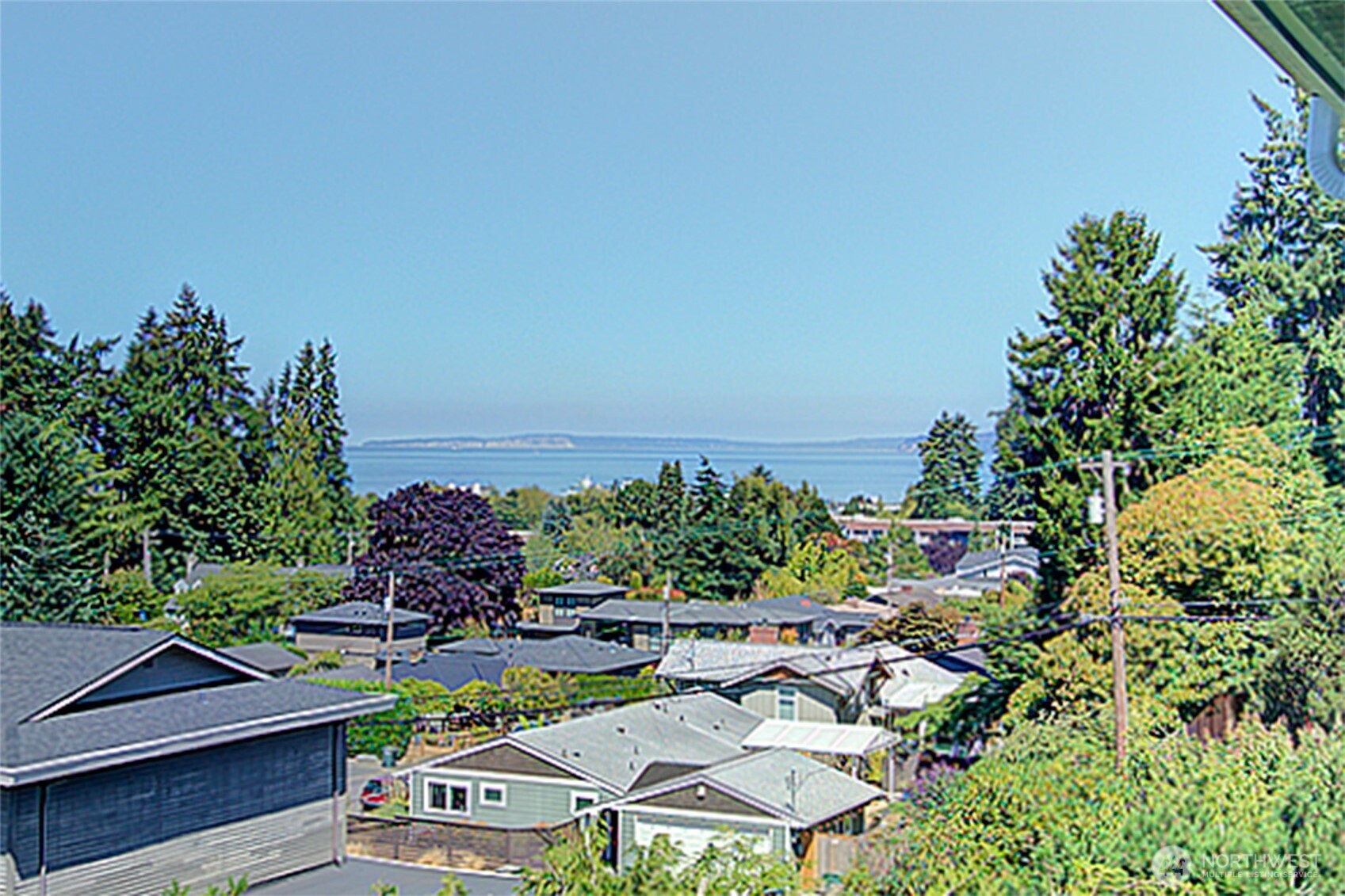 Downtown Edmonds just blocks from ferry terminal, train station, waterfront beaches & restaurants. Top floor, well maintained building & HOA. Large living room w/sound & territorial view and large deck. Gourmet kitchen w/custom birch cabinets, SS appliances, granite counters, glass subway tile backsplash, undermount lighting & bamboo floors. Newer windows, washer & dryer in unit. Large primary bedroom (fits king-sized bed) & bath. Freshly painted inside. All units owner occupied, Rental Cap 3. HOA includes: Water, sewer & garbage, earthquake insurance, free extra laundry, cable & internet. Roof & gutters less than 5 yrs. Pets okay w/restrictions. Location! Location! Location!