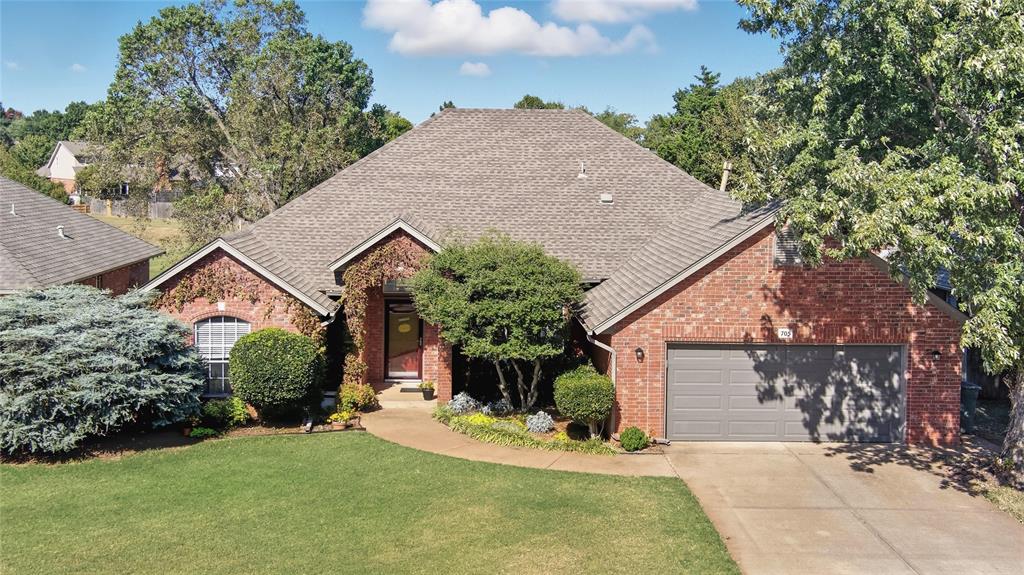 First offering in many years! Welcome to this beautifully maintained home situated on a peaceful greenbelt in Edmond's Copperfield Addition. This 4 bedroom, 2 bathroom home features wood look porcelain tile flooring throughout the living room, dining room, kitchen, laundry room, bathrooms and hallways. The living room is complete with large windows overlooking the greenbelt and a cozy gas log fireplace. The kitchen beckons all to gather around while meals are being prepared with ample counter space, an abundance of cabinets and additional eat in area. Each bedroom is sized well, with the primary bedroom giving way to a spa-inspired bathroom and large walk in closet. Step outside into your private oasis with a deck designed for both relaxation and entertainment. Many updates recently completed including newer carpet in the bedrooms. This home checks all the boxes. Enjoy the convenience of the neighborhood pool just a short walk down the street.  Schedule your showing today!