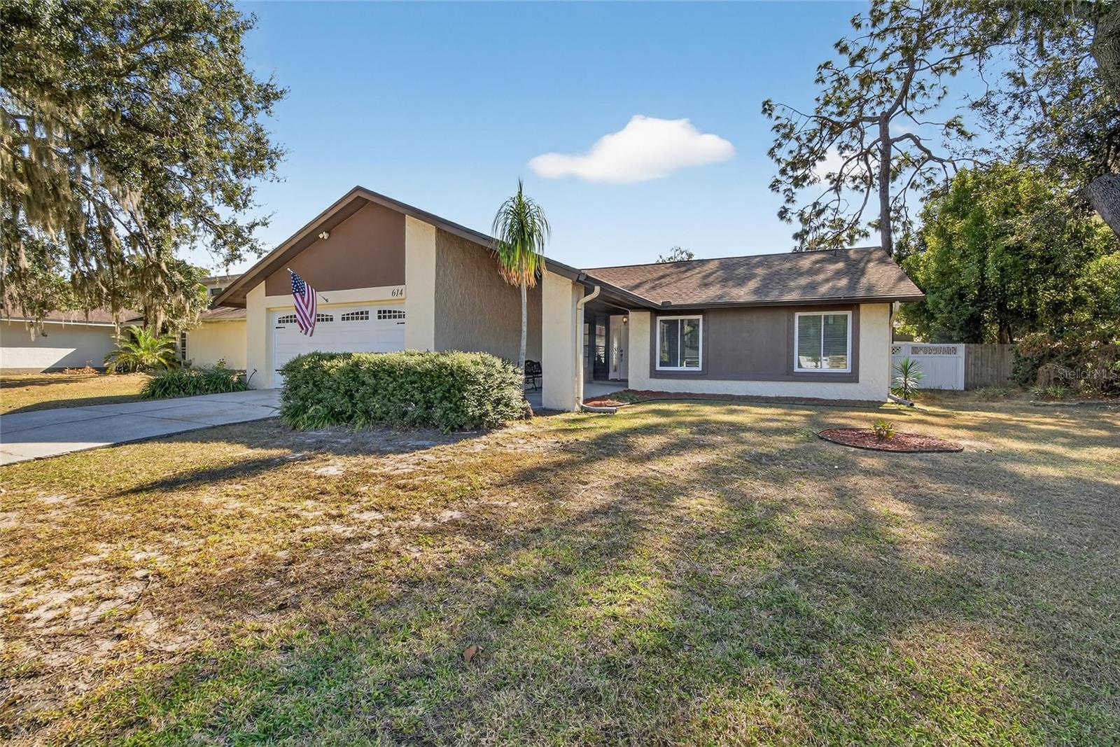 Welcome home to this inviting 3-bedroom, 2-bath residence offering 1,541 square feet of comfortable living space in the desirable Walden Lake community. Built in 1978 and thoughtfully updated, this home checks all the important boxes with a 2022 roof, 2024 A/C system, 2024 water heater, and fresh interior paint completed in 2025.Step inside to an abundance of natural light and attractive, scratch-resistant laminate flooring that sets the tone for a warm and welcoming living space. The refreshed kitchen (2025) provides a functional layout ideal for everyday living and entertaining alike. Sliding glass doors and select windows were replaced in 2026, enhancing both efficiency and natural light throughout the home.The floor plan flows seamlessly to an expansive 18x41 rear patio—perfect for hosting gatherings, relaxing outdoors, or enjoying Florida living year-round. The wood-burning fireplace adds character and cozy charm, while the two-car garage offers ample space for parking, storage, or hobbies. Additional features include a water softener loop, allowing you to customize to your preference.Located in Flood Zone X and nestled in Walden Lake with a low HOA, residents enjoy access to a community pool, clubhouse, playground, and tennis and basketball courts—all within walking distance. Conveniently located near shopping, dining, and major roadways, this home is ready for its next chapter. Schedule your private showing today!