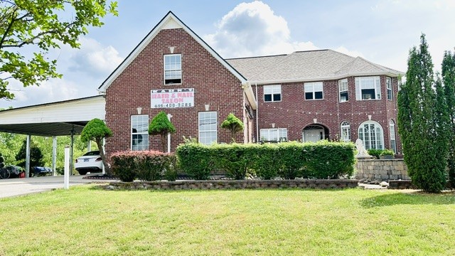 LOCATION LOCATION!Stunning single-family home with residential/commercial potential, offering the perfect blend of space, comfort, and versatility.  Conveniently located near interstate 24 off Almaville Road, the property offers easy access to surrounding commercial districts, shopping, dining, and major business corridors. Its prime location provides excellent connectivity while being close to a wide range of everyday amenities and growing commercial development. This beautifully designed two-story property features a luxurious upper-level master suite complete with private walk-out covered balcony-the perfect place to relax & enjoy the view. Upstairs also includes 2 additional bedrooms, full bathroom, & unfinished bonus room ready to be customized to fit your needs. The lower level offers a guest bedroom with full bathroom, ideal for visitors or multigenerational living. Hardwood floor throughout. Step outside to an oversized covered patio overlooking an exquisitely landscaped yard spanning nearly 1 acre. Storage building, covered storage area perfect for boats, lawn equipment, or add'l recreational storage. A large driveway with carport for extra car parking. No City property taxes. No HOA.  On septic tank,  Roof 2024, All electric utilities. All kitchen appliances to remain.  This exceptional property offers privacy, functionality, and endless possibilities in a truly beautiful setting. Buyers and buyer's agent to verify any important information.