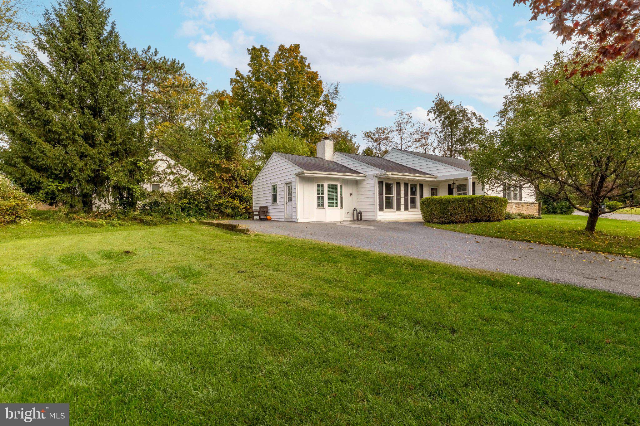 Move right into this classic ranch, ideally situated on a quiet cul-de-sac in a desirable Malvern neighborhood. Set on nearly half an acre, this thoughtfully designed home offers comfortable one-floor living, inviting indoor spaces and a private backyard setting. A welcoming front porch opens to the spacious living room, where beautiful hardwood floors, a brick fireplace and oversized windows create a warm first impression. The adjoining sun-filled family room features built-in bookshelves, cabinetry and a charming window seat, providing additional space for relaxing, entertaining or working from home. The updated galley kitchen is appointed with quartz countertops and stainless steel appliances and opens to the dining area overlooking the backyard. A spacious renovated laundry and mudroom offers custom built-ins and new sliding glass doors leading to the rear deck. The private primary bedroom features an updated en-suite bath. Two additional ample sized bedrooms and a full hall bath complete the main level. A floored attic provides abundant storage space. Outside, the fully fenced backyard offers plenty of room for relaxing, entertaining and outdoor activities. Two storage sheds provide additional space for gardening equipment, tools and seasonal items. Recent improvements include new siding and gutters, exterior painting, central air conditioning, a heat pump and a boiler. Located within the award-winning Great Valley School District, the home is just minutes from the shops and restaurants of Malvern and Frazer, as well as the Chester Valley Trail. Convenient access to Routes 202, 30 and 29 and the Pennsylvania Turnpike offers an ideal combination of a neighborhood setting and everyday convenience.
