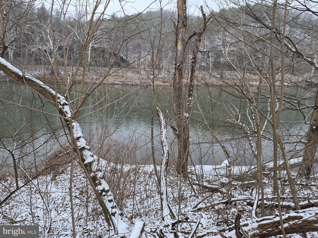 This property is a unique find. 4.86 acres with 318.94 feet of water frontage along the Potomac River.  It offers an ideal setting for extended weekend getaways, featuring opportunities for fishing, swimming, kayaking, or simply unwinding by a campfire with your RV or tent.   Newly surveyed and perc test approved.