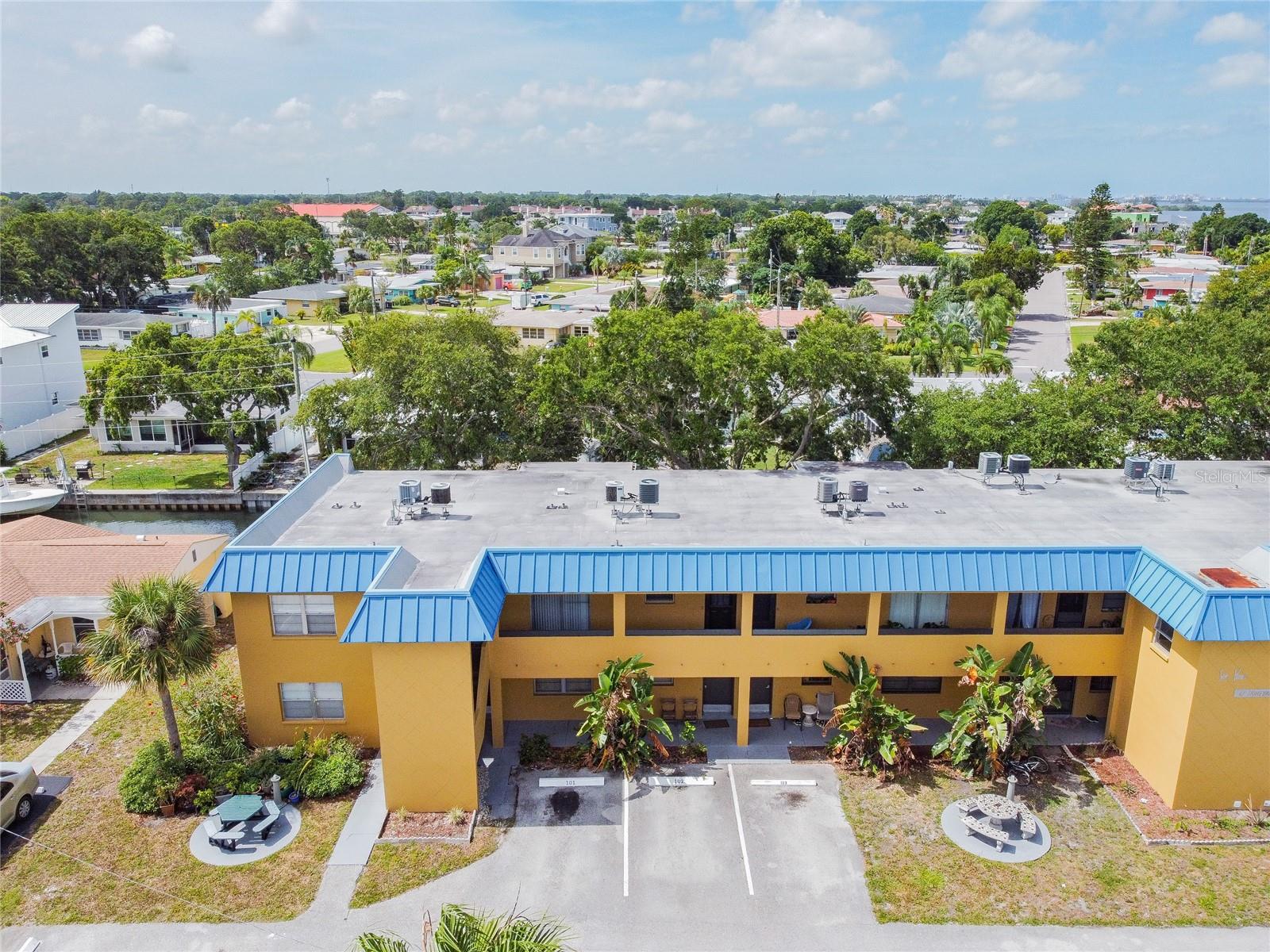 LOCATION, LOCATION, LOCATION! Great coastal neighborhood with many local restaurants, shopping, and groceries. Enjoy easy access to Honeymoon Island State Park, Downtown Dunedin, the Pinellas Trail, and more!  This second-floor condo offers 2 bedrooms, and 1 full bathroom, with canal views from the bedroom and the living room. The Dining Room and Living Room are open concepts. The building offers two laundry rooms with access to machines. This is a turnkey condo, already furnished and equipped for short term vacation rentals or your very own beach condo. Recent updates include new flooring and fresh paint.
