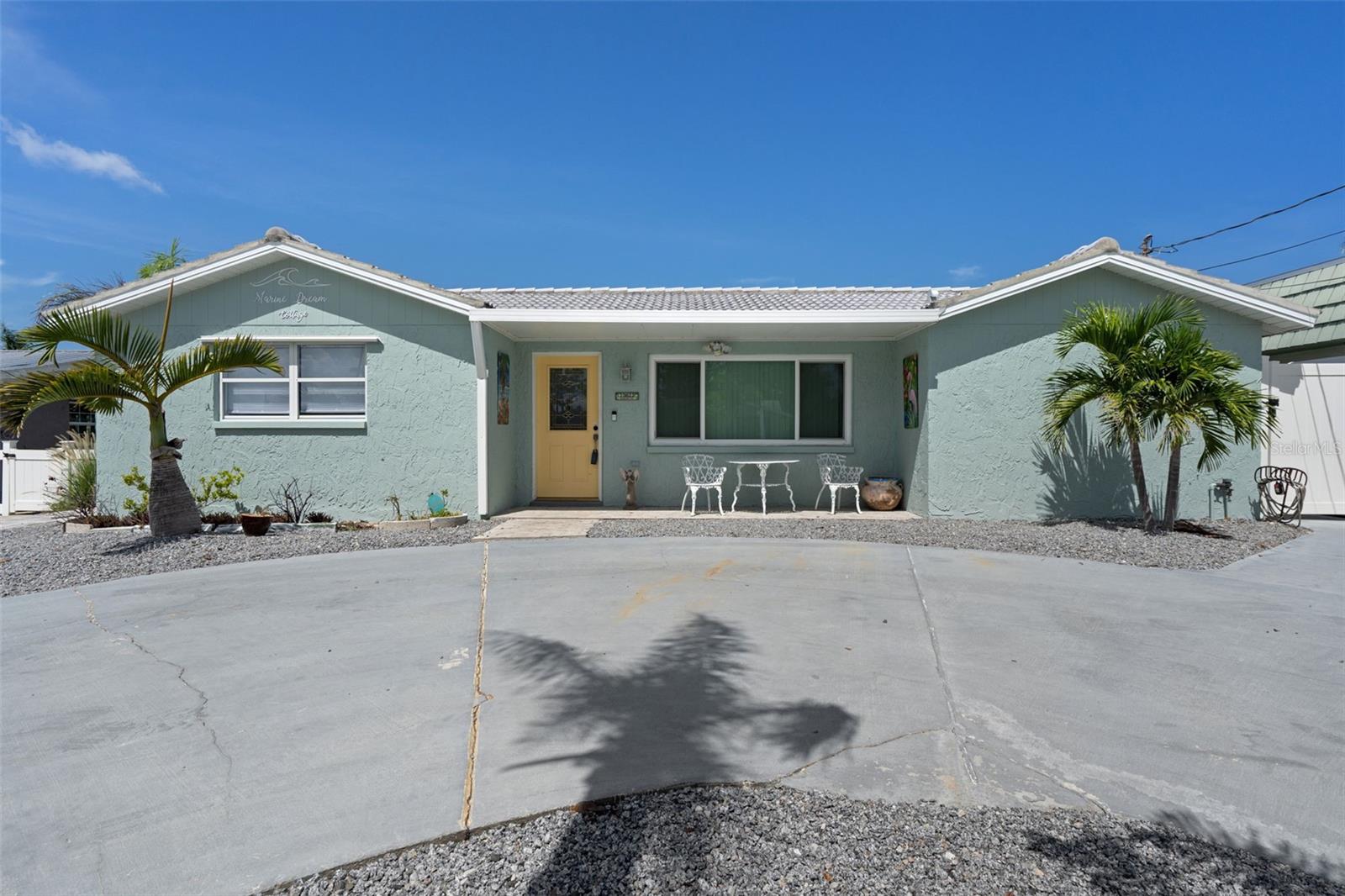 Marine Dream Cottage - Coastal Luxury Less Than 800 Feet from the Gulf!

Welcome to your waterfront escape in Hudson! This fully renovated 3-bedroom, 2-bathroom coastal gem offers the ideal blend of comfort, style, and location—just steps from the Gulf of Mexico. Whether you're looking for a full-time residence, a vacation getaway, or an income-producing investment, this home checks every box.

Inside, the open-concept living room (18x12) is filled with natural light and features plank-style tile flooring and double-pane windows throughout. The stunning 16x12 kitchen has been completely updated with granite countertops, stainless steel appliances, sleek fixtures, and crisp cabinetry. A cozy breakfast area opens to the enclosed 24x10 rear patio via sliding doors with built-in blinds—perfect for year-round relaxation.

A split-bedroom layout provides privacy for guests and owners alike. The spacious 19x11 primary suite boasts its own access to the rear patio, generous closet space, and a beautifully remodeled en-suite bath with a tiled walk-in shower and updated vanity. Two additional guest bedrooms (14x12 and 11x11) share an upgraded bath with a tub/shower combo.

Outside is a true tropical paradise. The fenced backyard features mature landscaping, a low-maintenance pebble/stone yard, and a circular paver driveway with walkways surrounding the home. Relax in the heated, kidney-shaped pool with Diamond Brite finish and waterfall feature, or unwind on the 30x24 open paver patio overlooking the canal.

Waterfront amenities include a large wooden dock, private boat lift, and wood deck—launch straight from your backyard and live the salt life with ease. Additional perks include 2023 AC, 2016 roof, seawall, and pool, a 6x8 storage shed, outdoor shower, and vinyl privacy fencing with dual gates.

Don’t miss this rare opportunity for resort-style living on Florida’s Gulf Coast. Schedule your private tour today!