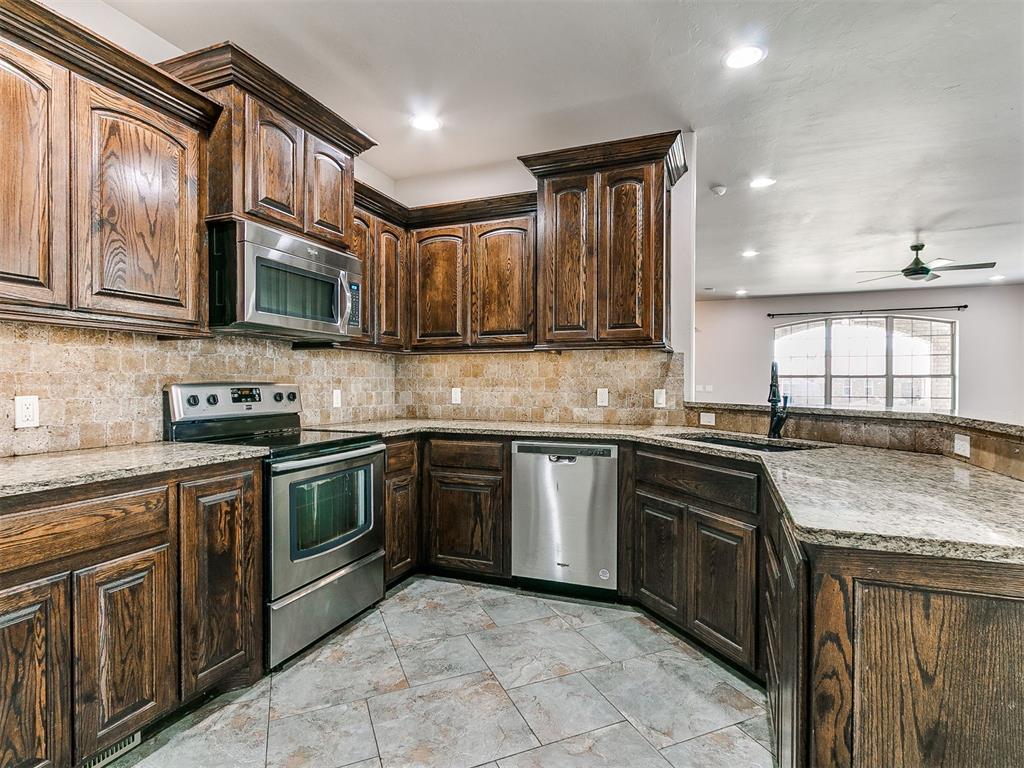 This move-in ready, beautifully maintained home offers 2,451 sq. ft. ~ welcoming blend of comfort, style, and convenience. Step inside to find open floor plan, fresh interior paint, high ceilings, and rich wood-trim ~elevates the kitchen and living spaces. The kitchen is large with stainless steel appliances, granite countertops, with plenty of counter space, tons of cabinets, composite sink, and a large pantry. The large primary suite not only features dual vanities in the en-suite bathroom but also has custom walk-in closet with built-ins. Secondary bedrooms with large walk-in closets, custom builts, and third (3) full bathroom. There is also a flex space that can be used as an office, workout room, playroom, game room, etc... Don’t forget to check out the backyard. It has been nicely manicured with a covered patio, and a beautiful pool. There’s also a storm shelter in the garage. The 3-car garage is heated, cooled, and has pull through, oversized garage doors, solar panels – to help you save money, and full guttering. This home checks all the boxes and is close to everything you need~ including a large playground and neighborhood park.  Conveniently located approximately 15 minutes to Downtown Oklahoma City, fine and casual dining, shopping, and healthcare are all easily with reach. This home is move-in ready and offers a wonderful blend of upgrades, layout, and location. Schedule your showing today!