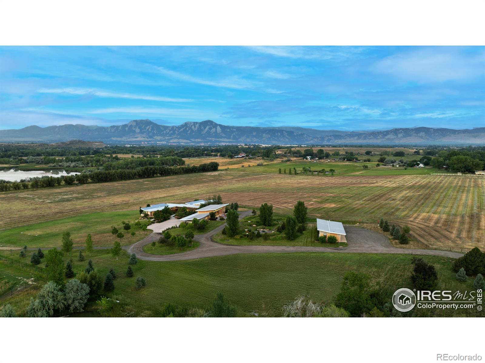 Unparalleled. Shanidiin Farm is a rare 40-acre sanctuary offering the ultimate in privacy, views, understated elegance, and sustainable design-all just 10 minutes from downtown Boulder. Named for the Navajo word meaning "ray of light," the estate lives up to its name in every detail. Thoughtfully oriented and masterfully designed, the home captures light, filling interiors with warmth while framing sweeping views of the Flatirons and back range. Bordering Open Space, the property feels infinite, a private world of its own where land, sky, and architecture converge. Designed by Gettliffe Architecture and brought to life by master builders Harrington Stanko, Shanidiin Farm is a triumph of detail and intention. Walls of windows dissolve the boundaries between indoors and out, while polished concrete floors, soaring ceilings, and natural finishes create an atmosphere both grounded and radiant. No element of comfort or sustainability has been overlooked. Geothermal and solar systems, radiant floor heating, and central air conditioning ensure year-round efficiency and ease. Luxurious guest suites, each with en suite bath, provide privacy and comfort. Every aspect of construction reflects an unparalleled commitment to quality, from the placement of windows that capture morning light to the seamless integration of high-performance systems.The property also includes 96 shares of North Boulder Farmer's Ditch and cisterns providing 35,000-gallons of water storage for abundant irrigation. A substantial recreation "studio" offers endless possibilities be it world-class gym, spa, conference space, or creative retreat-complete with sauna and steam shower. Car collectors will value space for a 6-car garage with ATV compatibility. Evenings shine around the cowboy cauldron, perfect for campfires, stargazing, and creating memories. Shanidiin Farm is a generational sanctuary and modern work of art, unlike anything else in Boulder. LIVE BOLDER, LOVE BOULDER!