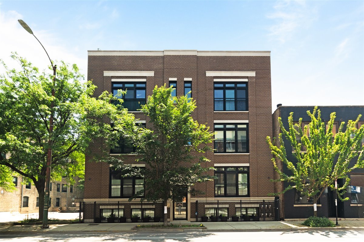 Welcome to this beautifully designed 3-bedroom, 2-bathroom condo, ideally located in the heart of Lakeview in an intimate six-unit building. Offering 1,600 square feet of luxe living space, this home seamlessly blends indoor comfort with outdoor enjoyment, thanks to a 200-square-foot private deck, ideal for entertaining, complete with a natural gas line for easy grilling. The open-concept living and dining area is anchored by wide plank solid white oak floors, a gas fireplace and custom built-ins, Sonos-enabled speakers, and stylish window treatments. The chef's kitchen is a showstopper, featuring quartz countertops, custom cabinetry, and premium appliances including a Fisher & Paykel integrated refrigerator, five-burner range, Miele dishwasher, warming drawer, and a brand-new vent hood (2024). The primary suite is a serene retreat with radiant heated floors, a spa-like bathroom with steam shower, soaking tub, dual vanities, and Italian porcelain tile. A custom walk-in closet with soft-close drawers adds practical luxury. The second full bath also includes radiant heated floors. Additional highlights include a smartly designed drop zone with built-in cubbies, in-unit laundry, heated garage parking, and a private storage room. All of this just steps from the Belmont Red, Purple, and Brown line stations, Whole Foods, and the lively Southport Corridor. High-end finishes, thoughtful design, and an unbeatable location make this Lakeview gem the perfect place to call home.