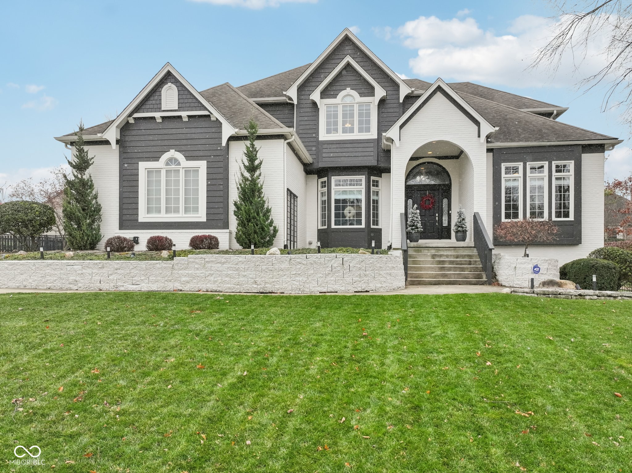 Make the Discovery... Warm & striking 4 bedroom, 6 bathroom, 3-car garage home tucked on a quiet cul de sac in desirable Foster Estates, offering an inviting blend of classic detail and thoughtful updates. Step into the two story foyer flanked by a formal living room and dining room, then on to the spacious great room with custom built ins and a two-sided fireplace that opens to the cozy hearth room flooded with abundant natural light. The large kitchen is designed for everyday function with generous cabinetry, granite countertops, center island with breakfast bar, planning desk, stainless steel appliances, and a sunny breakfast room that walks out to the deck for easy indoor and outdoor flow. Upstairs, you'll find all new carpet throughout and additional walk-in attic storage. The generous primary suite features a tray ceiling, two walk-in closets, and private bathroom wrapped in grey marble tiling with a freestanding garden tub, massive walk-in shower, and dual vanities. Bedroom 2 enjoys its own ensuite bath and bedrooms 3 and 4 share a Jack and Jill bath, all with walk-in closets. The finished basement extends the living space with a large recreation area, additional family room, full bathroom, and excellent storage space, creating flexible zones that can adapt as needs change. Outside, relax or entertain in the beautifully landscaped and fully fenced-in backyard with an expansive deck and lower level patio that take full advantage of the cul-de-sac setting. Award winning Carmel Clay schools, convenient access to shopping, dining, and amenities in the vibrant Arts and Design District, plus a neighborhood pool, clubhouse, and community events all make this an exceptional place to call home. Seeing is believing!!