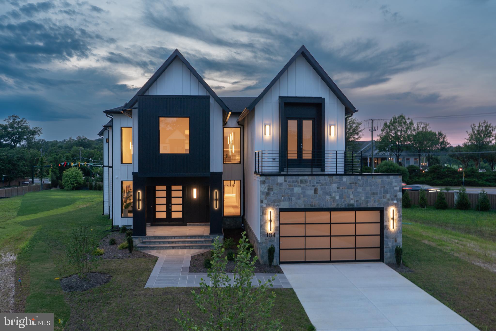 Experience elevated living in this luxury new construction architectural gem—where thoughtful design, luxury finishes, and a prime location just steps from Westwood Country Club come together seamlessly. Designed with entertaining in mind, this home offers the perfect setting for hosting everything from large celebrations to intimate gatherings with ease and elegance.A dramatic two-story foyer welcomes you into over 7,450 square feet of artfully crafted living space featuring 7 bedrooms and 6.5 bathrooms. The open floor plan flows effortlessly through formal and informal living areas, highlighted by 10-foot ceilings, expansive picture windows, and warm wide-plank hardwood floors throughout the main level. The chef’s kitchen is a true showstopper—complete with a 9-foot center island. For easy everyday living there is a supplemental culinary food prep with a large sink, serving counter, built-in cabinetry and a second dishwasher. Miele appliances, a 60-inch side by side refrigerator, a built-in plumbed coffee station, and a separate butler’s pantry, all beautifully designed for everyday living and effortless entertaining.The family room features a sleek ceiling design with integrated tape lighting, a linear gas fireplace with passive heat flow, and a wall of windows that open to a massive deck with a trellis-style ceiling and shades—creating a seamless indoor-outdoor experience for guests. There is also a screened porch which is accessible from the kitchen, family room and the deck.  Round out the main level is a secondary suite that can be used as an office or bedroom, adding to the versatility of the home's layout. Completing the main level is a spacious three-car tandem garage equipped with two EV charging outlets.The open staircase, detailed with custom Poplar wood partitions, is a design centerpiece leading to the second level where you are greeted by a spacious informal living area. The primary suite is a luxurious retreat featuring its own heating and cooling system, two walk-in closets, a spa-inspired bath, and a private sitting room with fireplace—ideal for ideal mornings or unwinding at the end of the day.  Three additional spacious bedrooms each with its own bathroom and ample closet, and one with balcony for outdoor enjoyment.The sprawling lower level features a stunning recreation area with a wet bar and a media room. Additionally, there are two flexible rooms that can serve as bedrooms or an exercise space, along with a full bath. French doors provide access to a covered patio, ensuring privacy and comfort for guests or multigenerational living.Situated in a private six-home cul-de-sac with no HOA, this home offers both privacy and convenience—walkable to shops, Whole Foods, restaurants, and coffee spots, and minutes from Tysons Corner and Metro access. With standout design and a layout built for entertaining, this home delivers an unmatched lifestyle in one of Vienna’s most desirable locations.