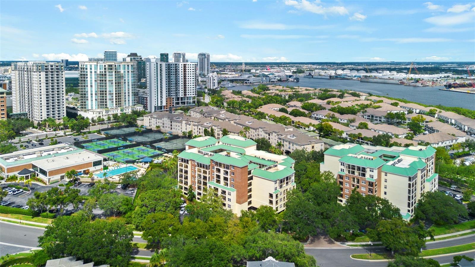 Coming soon..Experience the best of Harbour Island living in this beautifully updated 2-bedroom, 2 1/2 -bath condo located within one of downtown Tampa’s most desirable gated communities. Tucked behind the main gates in a private residential setting, this home offers a peaceful retreat while keeping you just minutes from everything downtown Tampa has to offer. Step inside to an inviting, well-maintained interior featuring ceramic tile flooring throughout the living room and kitchen downstairs and real wood flooring in the bedrooms, stairs and landing upstairs. Two story ceilings await in the main living area giving it a penthouse feel. The spacious upstairs primary suite features a walk-in closet, private  ensuite bath with a walk-in shower and vanity, and sliding glass doors leading to a 72-square-foot balcony. Enjoy relaxing views of the surrounding greenery and wooded skyline from one of two balconies, which also includes additional storage.On the main floor you will find another bedroom with ensuite bathroom. High-impact windows and doors were installed, adding both security and peace of mind. The condo also includes one assigned under-building garage parking space, along with approximately 90 additional unreserved parking spaces surrounding the condominium buildings. Residents can enjoy the community’s beautiful pool and hot tub, lush landscaping and the privacy of gated Harbour Island living. With convenient access to major roadways and all the dining, entertainment, shopping and attractions of downtown Tampa nearby, this condo offers a great combination of comfort, convenience and location. Move in, add your personal touches and start enjoying the Harbour Island lifestyle!
