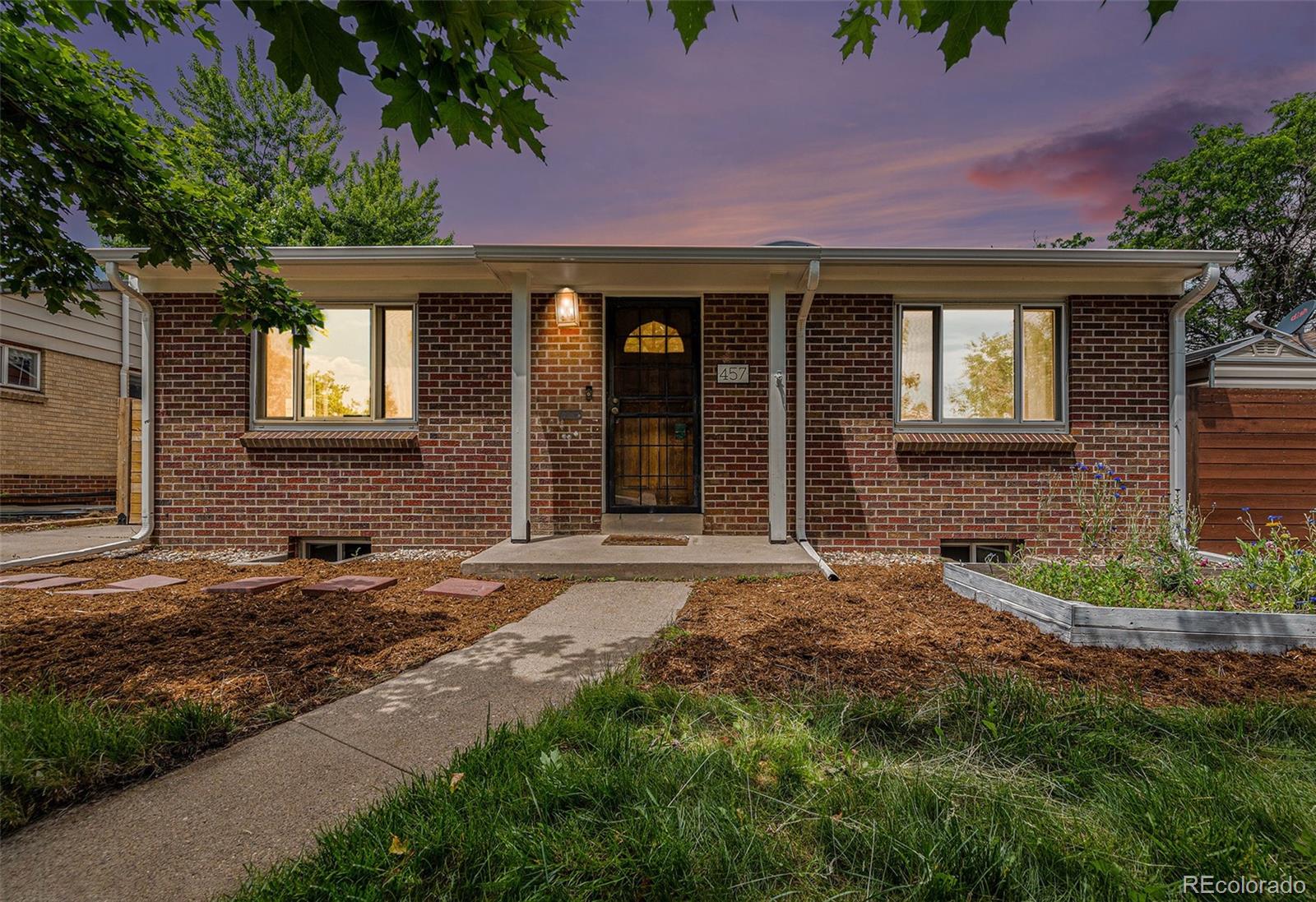 Welcome to this beautifully updated 2-bedroom, 2-bath brick home in South Hilltop that blends classic character with modern comfort. Step inside to discover an open, light-filled layout and a freshly updated kitchen featuring Corian counters and stainless appliances, perfect for cooking and entertaining. The finished basement offers valuable extra living space— including a bedroom with an egress window, a full bathroom, and an expansive family room. Out back, you'll find a large, private fenced yard that feels like your own personal oasis. Relax or entertain on the expansive patio, shaded by a stylish pergola—perfect for summer barbecues or quiet evenings outdoors. With timeless curb appeal and thoughtful updates throughout, this home is move-in ready and made for easy living inside and out! Conveniently located within biking distance of Lowry, Hilltop and Cherry Creek, and a short distance from Park Burger, High Point Creamery, Call Your Mother Bakery, and Crestmoor Park. Schedule your showing today!