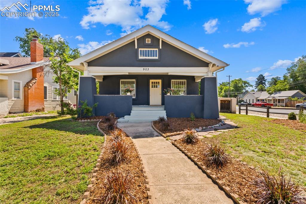 Welcome to this charming historical bungalow, built in 1918 and situated on a corner lot near the coveted Old North End neighborhood. This 3-bedroom, 2 full bath home has been thoughtfully updated and offers the potential for rental income from the basement, which features a separate entrance or simply enjoyed as a spacious family home.

As you enter through the inviting covered front porch, you'll find a bright, open living and dining area with original hardwood floors. The home has been freshly painted throughout. The main level feautures 2 nice sized bedrooms and a full bathroom.

The kitchen boasts new LVP flooring, ample storage and countertop space, and a breakfast bar. Just off the kitchen, you will find a deck that leads to the backyard. The downstairs area features new carpet and includes another kitchen with new LVP flooring and appliances. Additionally, you will find a family room, the third bedroom, and a full bathroom, plus a 4th bedroom/bonus room to use at your discretion. The laundry room with washer & dryer included is equipped with a sink and a NEW furnace.

Upon entering the gated driveway, you discover a private backyard with ample space for entertaining, complete with a storage shed and bench seating on the patio—ideal for outdoor gatherings and barbecues. Great opportunity to own a home with NO HOA and minutes to Downtown for restaurants, shopping and parks. Home is move-in ready!