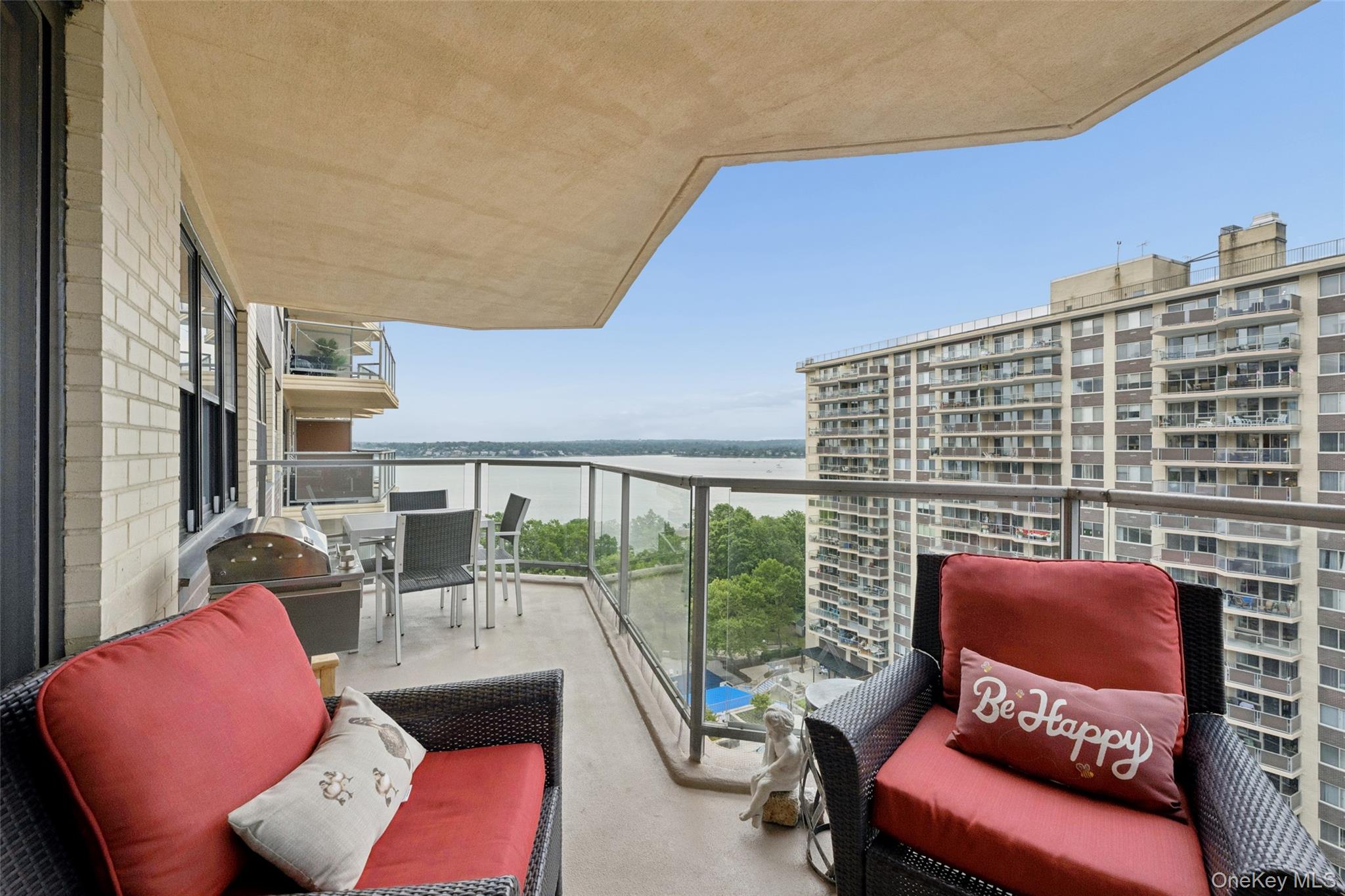 Wake up to shimmering water views and end your day with sunset skies from an oversized private terrace—this is elevated, resort-style living at Towers at Waters Edge. Perched high above the grounds on the 12th floor, this beautifully maintained 2BR/2BA residence offers a bright, open layout with generous proportions, crown molding, and wide windows that fill the home with natural light.The heart of the home is the expansive kitchen, featuring warm wood cabinetry, granite countertops, stainless-steel appliances, and a large breakfast bar that flows seamlessly into the dining and living areas—ideal for entertaining and effortless everyday living. The living room opens directly to the terrace, creating the perfect indoor/outdoor lifestyle for morning coffee, alfresco dining, and weekend lounging with panoramic views.Behind French doors, a versatile bonus room provides the ideal space for a home office, den, guest room, or creative studio. The primary bedroom is a calm retreat with outstanding storage, including a custom wardrobe system with dedicated dressing/vanity area and shoe storage, while the spa-like bath showcases sleek finishes and a rain-style shower. A second full bathroom, also thoughtfully updated, features a crisp modern vanity and a glass-enclosed shower—perfect for guests or a second bedroom setup.Residents enjoy coveted amenities including beautifully landscaped grounds, 24 hour doorman and security, outdoor pool, tennis courts, fitness center, playgrounds, and convenient building laundry—delivering a true lifestyle component to this exceptional waterfront offering. Move right in and enjoy comfort, convenience, and views—every single day.