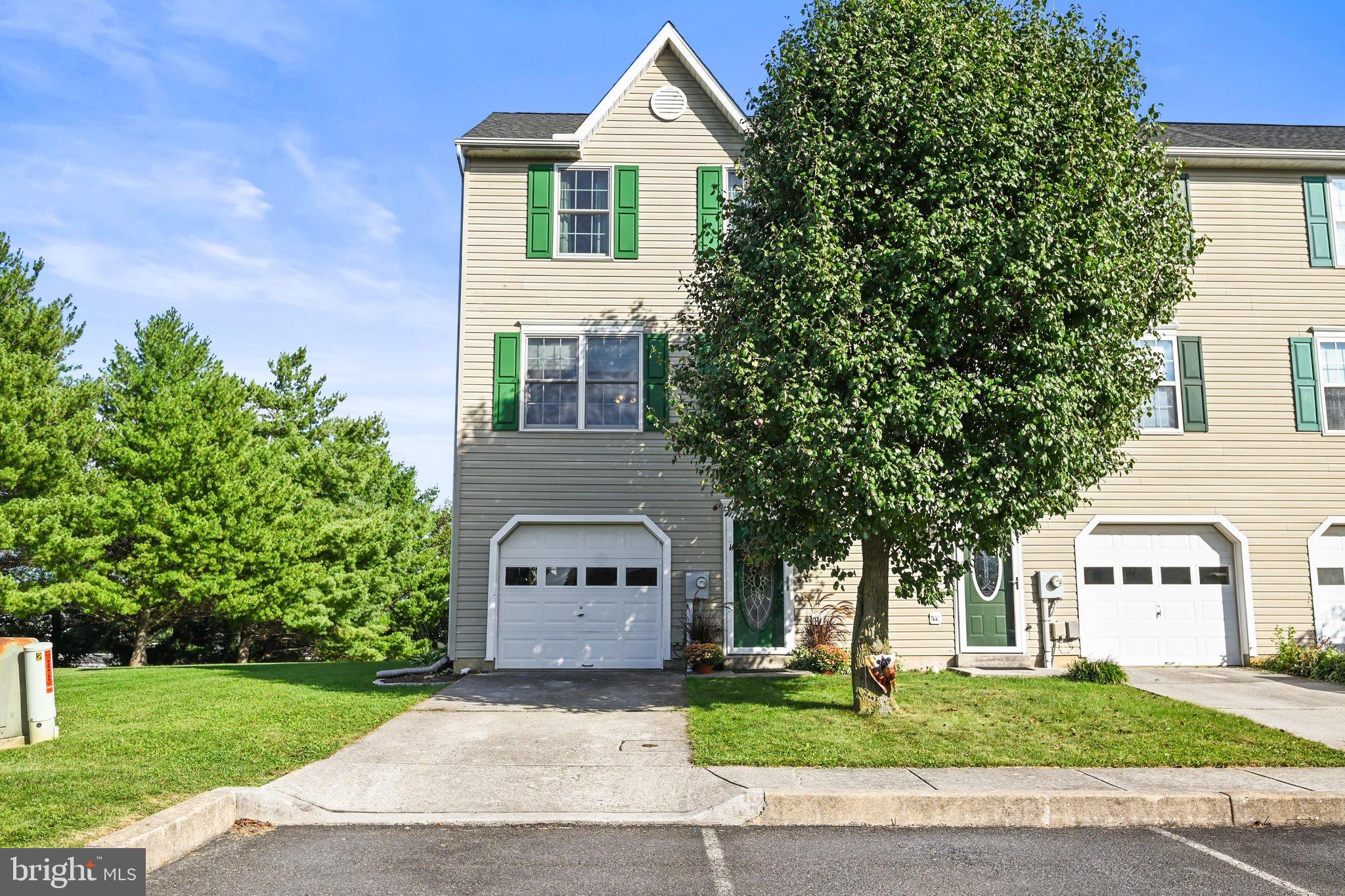 Welcome home to this well-maintained 2-bedroom, 1.5-bath townhome situated on a desirable corner lot! Enjoy the added benefit of adjoining HOA-owned vacant land, providing a more open feel and additional privacy. The home features all-new Renewal by Andersen replacement windows and attractive LVP wood flooring throughout the living room and kitchen. The family room offers convenient access to a nice deck—perfect for relaxing, outdoor dining, or entertaining. Upstairs you'll find two comfortable bedrooms and an updated full bath featuring tile flooring. The laundry area includes a convenient half bath. Additional features include a 1-car garage and storage shed, providing plenty of room for your storage needs. A wonderful opportunity for anyone looking for low-maintenance townhome living with updates already completed and a location that offers a little more breathing room!  Within walking distance to the baseball fields!