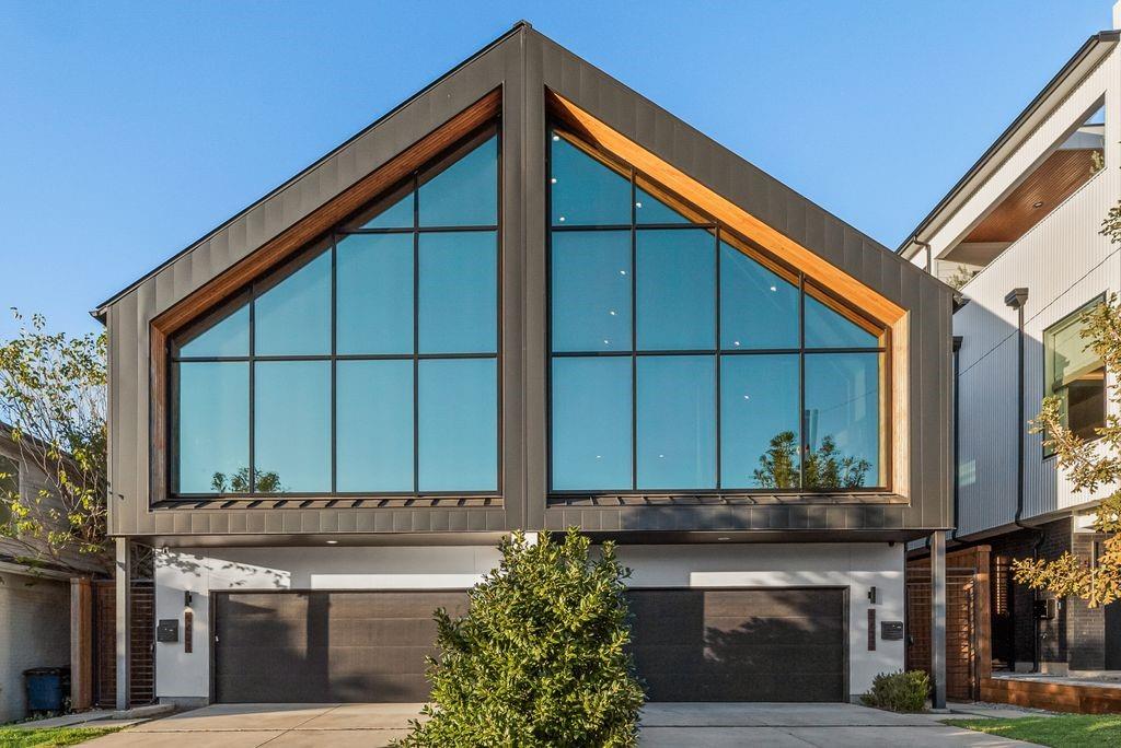 Experience modern living in the heart of Dallas in this stunning 4-bedroom, 4.5-bath contemporary half-duplex designed for effortless style and everyday luxury. From the moment you step inside, the home feels open, bright, and tailored for the way people truly live today.The sleek gourmet kitchen is a showpiece—complete with a built-in refrigerator, wine fridge, custom pantry pull-outs, quartz countertops, a striking backsplash, and an oversized island perfect for morning coffee, casual meals, or gathering with friends. A gas cooktop, stainless steel appliances, and built-in microwave and oven bring both beauty and function to the space.The living room is a true statement with its cathedral ceilings, expansive windows, and a clean-lined gas fireplace—all highlighted by beautiful light-stained hardwoods that continue throughout the home. The dining area offers an ideal setting for dinner parties or cozy nights in.The primary suite is a retreat all its own, offering a spacious sitting area and a spa-worthy bath with designer finishes, an oversized shower with rain head, and a freestanding tub that sets the tone for total relaxation.With two guest rooms on the main level—each with an ensuite bath—privacy and convenience come naturally. A third-floor guest suite opens to a stunning covered terrace featuring a fireplace, wet bar, beverage refrigerator, and outdoor living area. It’s the perfect spot for sunset cocktails, game-day gatherings, or quiet weekend lounging.Zoned for sought-after Mockingbird Elementary and perfectly positioned near restaurants, coffee shops, bars, boutiques, grocery stores, parks, and the trail systems that leads to White Rock Lake, the Katy Trail, and the Santa Fe Trail. Here, you can live a true walkable lifestyle—where everyday errands, morning runs, and nights out are all just moments from your door.Modern luxury. Urban convenience. Effortless living.This home delivers it all.