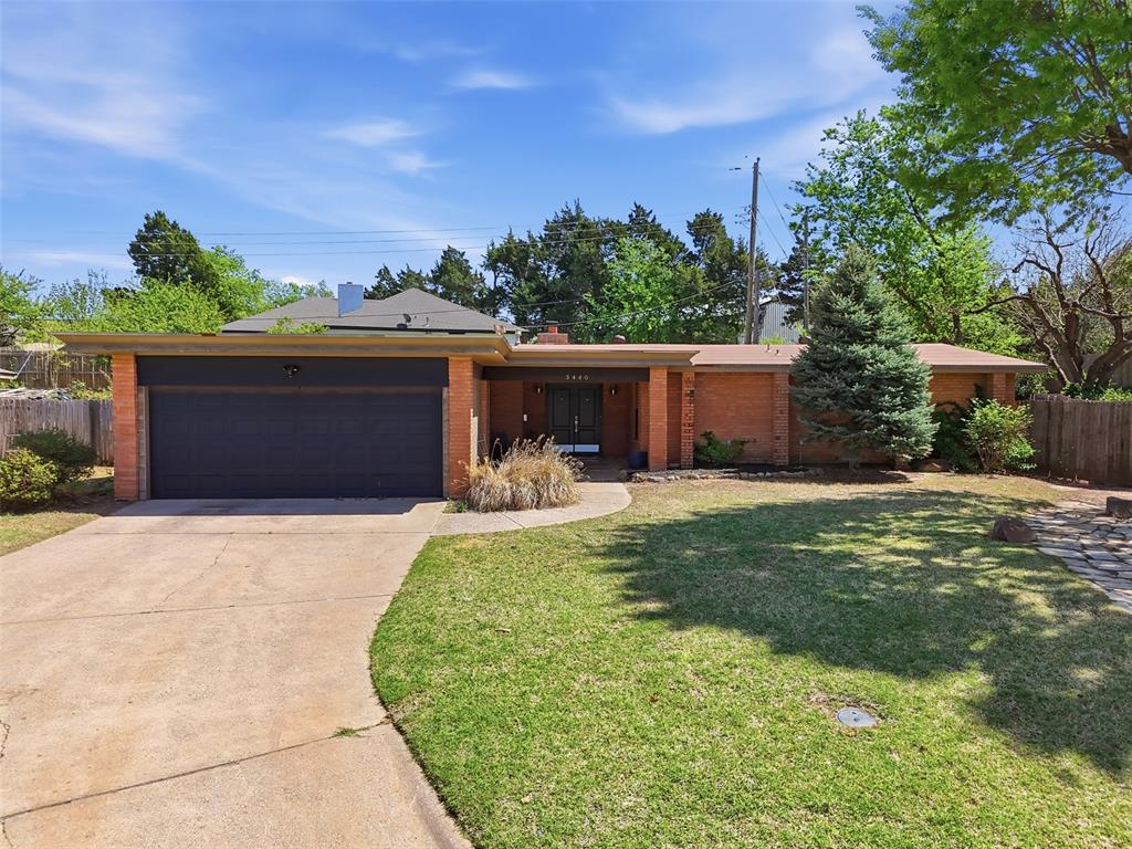 Welcome to this stunning mid-century modern gem nestled in the iconic Edgewater neighborhood, where timeless design meets everyday functionality. From the moment you arrive, the home’s character is undeniable. A beautifully curated concrete and pebble pathway leads to striking double doors, creating a warm and inviting first impression. Step inside to discover a thoughtfully designed floorplan filled with natural light and classic charm. The spacious living area is anchored by a perfectly placed feature fireplace, offering both comfort and style. Just beyond, the large U-shaped kitchen is equipped with stainless steel appliances and seamlessly connects to an oversized dining room—ideal for entertaining and effortless conversation between spaces. Convenience meets practicality with an indoor laundry room just off the kitchen, complete with ample storage. The primary suite offers a peaceful retreat with generous space, three closets, and a private en-suite bath featuring a walk-in shower. Two additional bedrooms and a well-appointed hall bath with double sinks and a separate shower provide plenty of room for family or guests. Outdoor living is equally impressive, featuring a charming patio and a tiered retaining wall that enhances the home’s authentic mid-century modern aesthetic. A side yard offers the perfect space for your four-legged companions to roam and play. Ideally located near Lake Hefner with easy access to shopping, dining, and recreation, this home offers the perfect blend of style, comfort, and convenience. Don’t miss your opportunity to own a true architectural gem in one of the area’s most desirable neighborhoods.