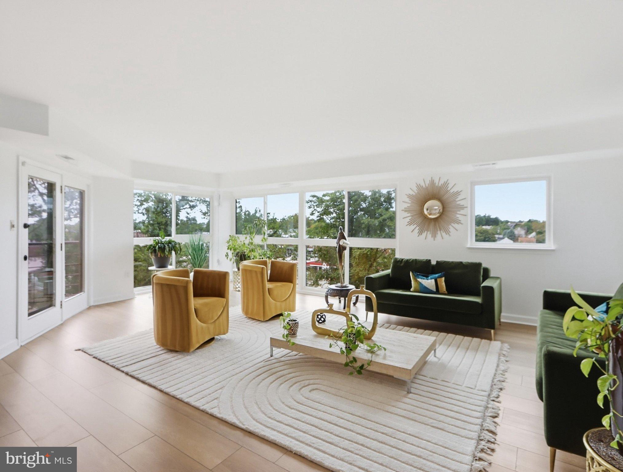 RARE ROLAND PARK OPPORTUNITY! ✨Welcome to elegant city living at its finest! This stunning 3-bedroom, 2.5-bathroom condominium offers 2,333 square feet of spacious, light-filled living in one of Baltimore City’s most cherished neighborhoods. From the moment you enter through the beautiful marble foyer, you’ll appreciate the timeless elegance, hardwood floors, breathtaking floor-to-ceiling windows that fill the home with natural light. Condo had new floors, lighting, painting and kitchen upgrade in 2023.Enjoy an open-concept layout, a well-appointed kitchen with breakfast bar and island, three generously sized bedrooms, and TWO PRIVATE BALCONIES! The primary bedroom offers its own private balcony with serene views of the lush gardens—a perfect place to enjoy your morning coffee. Add in two reserved garage parking spaces, guest parking, and ample storage, you'll  have a home that truly combines comfort, convenience, and sophistication.This exceptional condominium may be the one you’ve been waiting for! Located in beautiful Roland Park, you’ll enjoy access to vibrant dining, shopping and the charm of one of Baltimore’s most desirable communities.Condos like this one, rarely become available. Don't miss your opportunity to make this exceptional home your own!