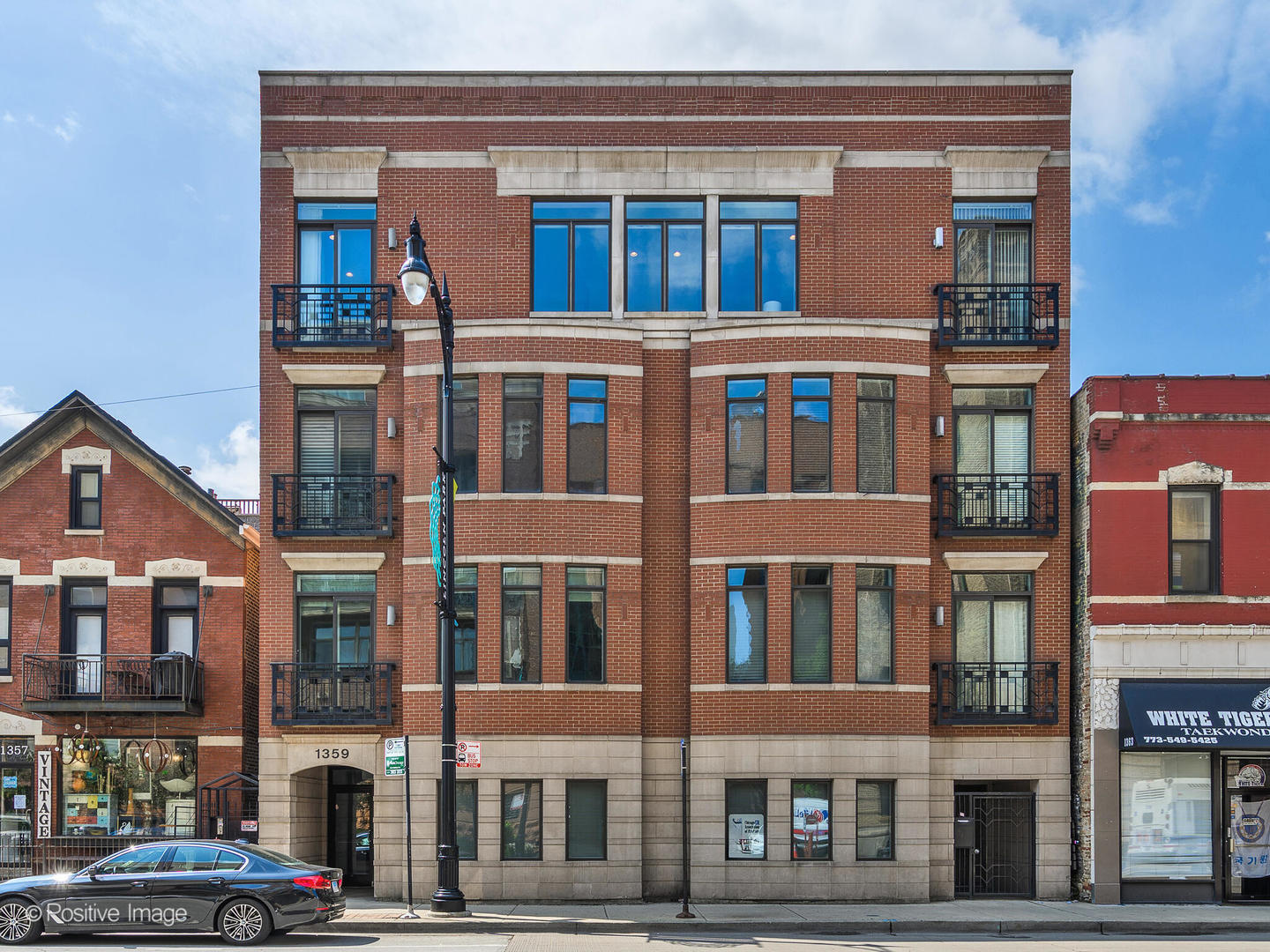Luxury Penthouse Living in the Heart of Lincoln Park!  Welcome to the Penthouse at 1359 W Fullerton - a truly exceptional 4-bedroom, 3-bathroom penthouse residence offering 3,200 square feet of single-level living with the privacy and exclusivity of direct elevator access to your home. This rare, full-floor gem boasts two expansive rooftop decks showcasing breathtaking skyline views!  The thoughtfully designed layout features soaring ceilings, abundant natural light, and a seamless flow between living, dining, and kitchen spaces.  The kitchen is designed to impress, featuring premium appliances including double ovens, sleek black stone countertops, custom white cabinetry, and an oversized island-ideal for cooking and entertaining. Retreat to the spacious primary suite complete with a spa-caliber bath and fully built-out walk-in closet. The generously sized library, featuring striking custom millwork, is currently utilized as a home office (and playroom) but can easily be enclosed to serve as a true fourth bedroom, if desired.  Additional highlights include exquisite architectural details throughout - intricate crown molding and richly crafted door and window trim, rich dark hardwood floors, larger  secondary bedrooms (one with ensuite bath) and ample storage throughout! TWO PRIVATE ROOFTOP decks with panoramic city views, TWO HEATED GARAGE parking spaces INCLUDED. Ideally located in vibrant Lincoln Park, with easy access to public transportation and steps to restaurants, shopping, parks, and top-rated schools ie OSCAR MAYER Elementary and Lincoln Park HS. This is penthouse perfection, where luxury meets lifestyle.