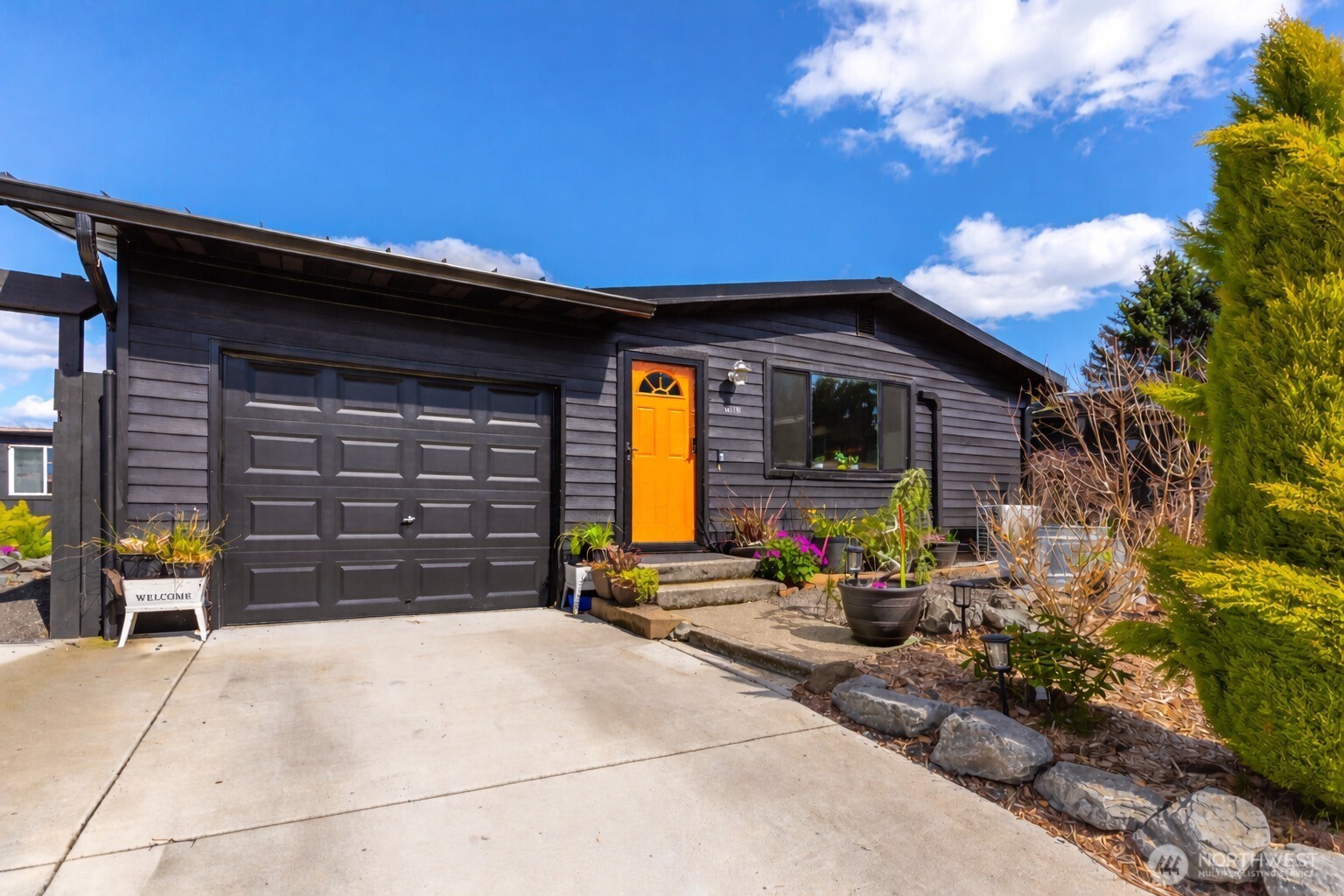So many homes come with a hidden to do list. This one? It's already done. NEW metal roof, A/C, electrical panel, plumbing, heat pump, windows, doors, flooring, appliances, lighting — and that’s not all of it.  This 3 bedroom, 1.75 bath Kent home has been completely transformed between 2021 and 2025 — not as a flip, but by a homeowner who planned to stay forever. Every upgrade was chosen with care, quality, and the long game in mind. Move in with confidence instead of a contractor's number on speed dial. The kitchen dazzles with quartz countertops, both bathrooms are fully updated, and the primary suite features a spa style walk-in shower with heated floors.   And then there's the backyard oasis. Hot tub. Sauna. Covered patio. Fully fenced with beautiful blooms throughout. This isn't just a yard — it's a destination. One-car garage. Brand-new driveway. Fresh paint inside and out. Located near Soos Creek with convenient access to parks, trails, shopping, and dining.  Homes renovated with this level of care don't come along often. See it this weekend before someone else calls it home!