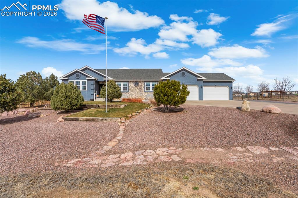 Welcome to a remarkable 1.59 acre horse property offering over 4,400 sq ft of refined living space with breathtaking views of Pikes Peak. This impressive 4+ bedroom, 4-bathroom residence blends luxury, privacy, and functionality in one exceptional setting. The main level showcases custom wood flooring throughout, multiple spacious living areas, and a thoughtfully designed layout ideal for both entertaining and everyday comfort. The primary suite serves as a private retreat, featuring a spa-inspired bathroom with a Jacuzzi tub and a custom walk-in shower with built in seating. The kitchen is equipped with newer appliances installed in 2024 and flows seamlessly into the home's living and dining spaces. Modern upgrades include a newer HVAC system (2025), front vinyl windows with a lifetime transferrable warranty, a Renew air exchange system, and a brand new AC condenser for year round comfort. The finished basement expands the living space and includes a Harmon pellet stove for efficient supplemental heating. Step outside and enjoy the serenity of 35 mature trees including cherry, apple, honey locust, and crabapple varieties! The property features custom outdoor living areas with large decks, water and electrical outlets on each deck including, built in planter boxes with drip irrigation. A massive 1,000 sq ft garage with 12 ft ceilings complete with a built in workshop. This exceptional property offers a rare opportunity to enjoy Colorado living. This is a must see!