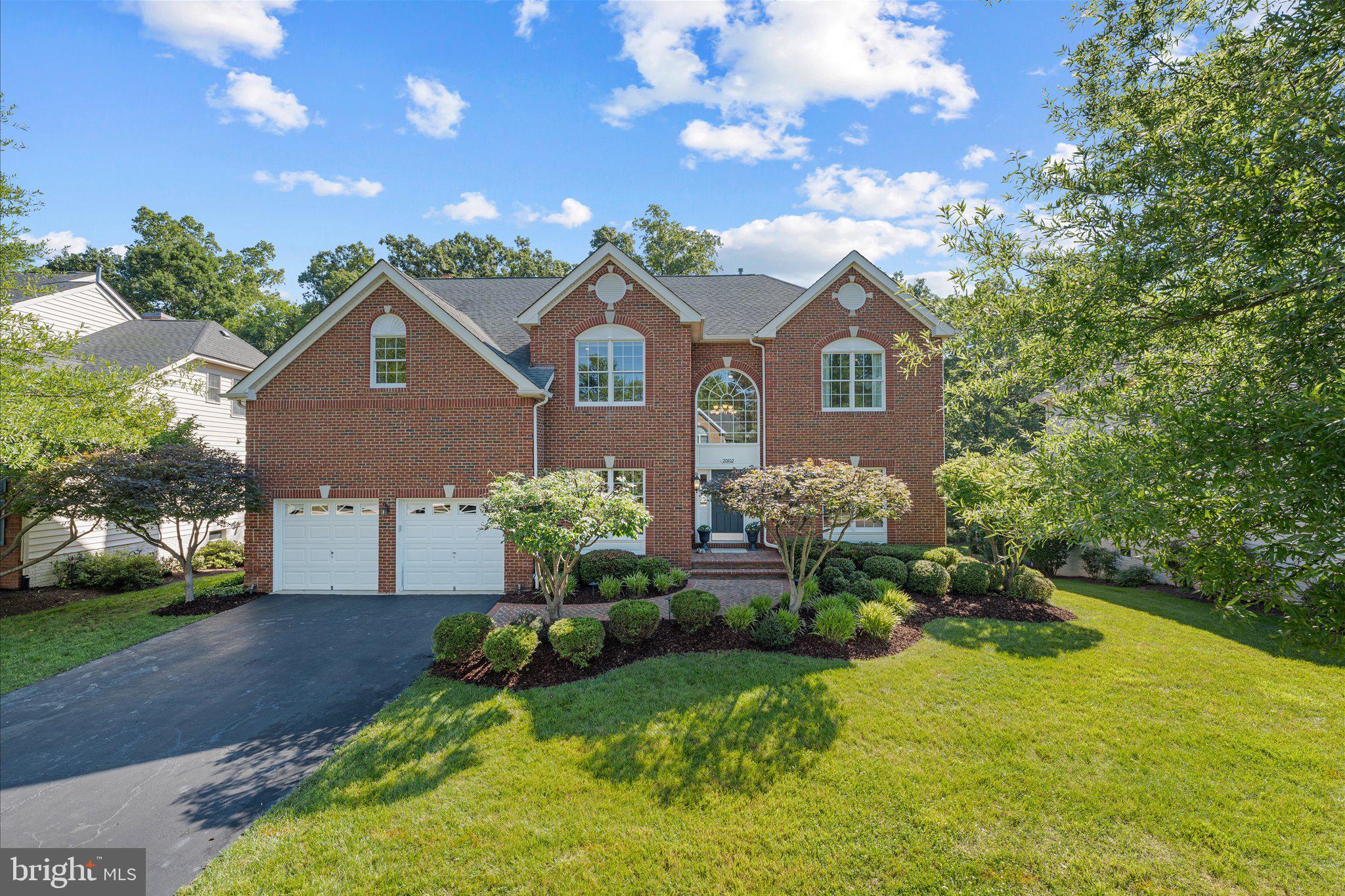 Welcome to luxury living in the gated community of Belmont Country Club. Perfectly positioned on a quiet street with mature trees all around, this exceptional four-sided brick home has been meticulously renovated from top to bottom, with huge attention to detail and premium finishes throughout. Rich custom millwork, extensive crown molding, coffered and tray ceilings, custom built-ins, and designer finishes create an atmosphere of quality in each and every room.At the heart of the home, the stunning gourmet kitchen has been completely reimagined with beautiful Carrara marble surfaces, premium Viking appliances, custom cabinetry, and thoughtfully designed spaces, including the kitchen island of your dreams. The kitchen flows seamlessly into the dramatic two-story family room, where soaring ceilings, elegant coffered details, and a breathtaking floor-to-ceiling stone fireplace create a truly spectacular gathering space. The extended sunroom creates a flexible space for another eating area, quiet seating room or tucking away the toys!The upper level offers spacious bedrooms and beautifully updated baths, while the finished lower level provides exceptional flexibility with a wet bar, dedicated fitness area, additional bedroom, and generous recreation space. The Carrera marble is carried in to every bathroom, the wet bar and even the well designed laundry room! Every room has been carefully curated to combine luxury, comfort, and functionality.Step outside to your own private outdoor retreat. Surrounded by mature trees, the backyard is designed for year-round enjoyment with a spacious deck, spectacular stone patio, outdoor fireplace, professional landscape lighting, and irrigation system. The home is conveniently located near the back gate of this fully gated community, providing easy access to all that Ashburn and the surrounding area has to offer. Residents of Belmont Country Club enjoy an unmatched lifestyle with gated security, an Arnold Palmer Signature Golf Course, multiple swimming pools, tennis and pickleball courts, a modern fitness center, scenic walking trails, an elegant clubhouse, playgrounds, and year-round social events. The HOA fee includes landscaping services, freeing up your weekends with hands off lawn care! Also included is high speed internet and cable. Ideally located in Loudoun County, the community offers convenient access to shopping, dining, entertainment, major commuter routes, the Silver Line Metro, One Loudoun, Lansdowne Town Center, and Dulles International Airport.A rare opportunity to own a truly move-in-ready luxury residence in one of Northern Virginia's premier country club communities—where exceptional craftsmanship, resort-style amenities, and everyday convenience come together.