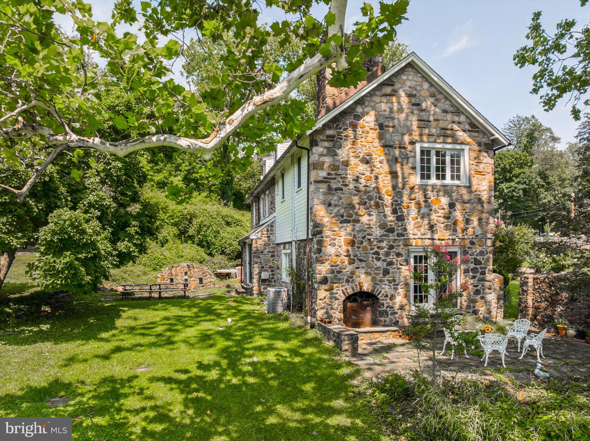 A Rare Main Line Stone Estate — Nearly Three Centuries of History on Over Three Scenic Acres.Opportunities like this rarely surface on the Main Line. Situated on over 3 scenic acres, this exceptional property combines timeless historic character with significant future development potential. Buyers should verify subdivision possibilities, permitted uses, and township approvals.Solid Washington Rock stone construction gives the residence exceptional craftsmanship, quality, and natural insulation. Original hardwood floors, three wood-burning fireplaces, and preserved architectural details reflect the historic character that Main Line buyers appreciate most.The grounds include a picturesque pond, mature trees, seasonal gardens, and fruit-bearing trees. A fenced area with a dog kennel suits pet owners, while the spacious patio and adjacent outdoor fireplace  create an exceptional setting for entertaining and outdoor living.The main level features a Living Room with soaring ceilings, a stone fireplace, custom built-in bookcases, and open gathering space ideal for entertaining, along with a formal Dining Room, Family Room, and Powder Room. The upper levels include a spacious primary suite with a sitting room and private bath, multiple additional bedrooms, flexible living areas, and three full baths. The finished lower level with a fireplace offers excellent space for a recreation room, game room, or media room. A separate guest cottage — with its own full bath, kitchenette, and served by natural spring water — provides flexible space for extended family, guests, or a private home office.Lovingly restored since 2005 while preserving its historic integrity, the estate offers privacy while remaining conveniently located within the Radnor Township School District, just minutes from Villanova University, SEPTA Regional Rail (Paoli/Thorndale Line), the Norristown High Speed Line, shopping, dining, and  major highways including I-76 and I-476, providing convenient access to Center City Philadelphia.A truly rare Main Line offering where history , exceptional craftsmanship, remarkable acreage, and  future possibilities come together.