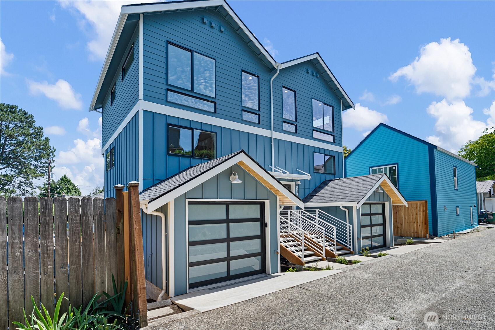 Welcome to this sun-filled new-construction home in Roosevelt, featuring 3 bedrooms, 2.5 baths, and an attached garage. The lower level includes a bedroom and 3/4 bath, ideal for guests or a home office. Upstairs, the open-concept living, dining, and kitchen area is filled with natural light. The kitchen features quartz countertops, a custom tile backsplash, and stainless steel appliances backed by warranties. The top floor offers two ensuite bedrooms, one with a full bath and the other with a 3/4 bath. Engineered hardwood floors throughout and mini-splits in every bedroom and living area provide year-round comfort. Ideally situated in the Roosevelt/Maple Leaf neighborhood, you'll enjoy easy access to I-5 and SR-522, plus a short bike ride to light rail. Don't miss this opportunity!